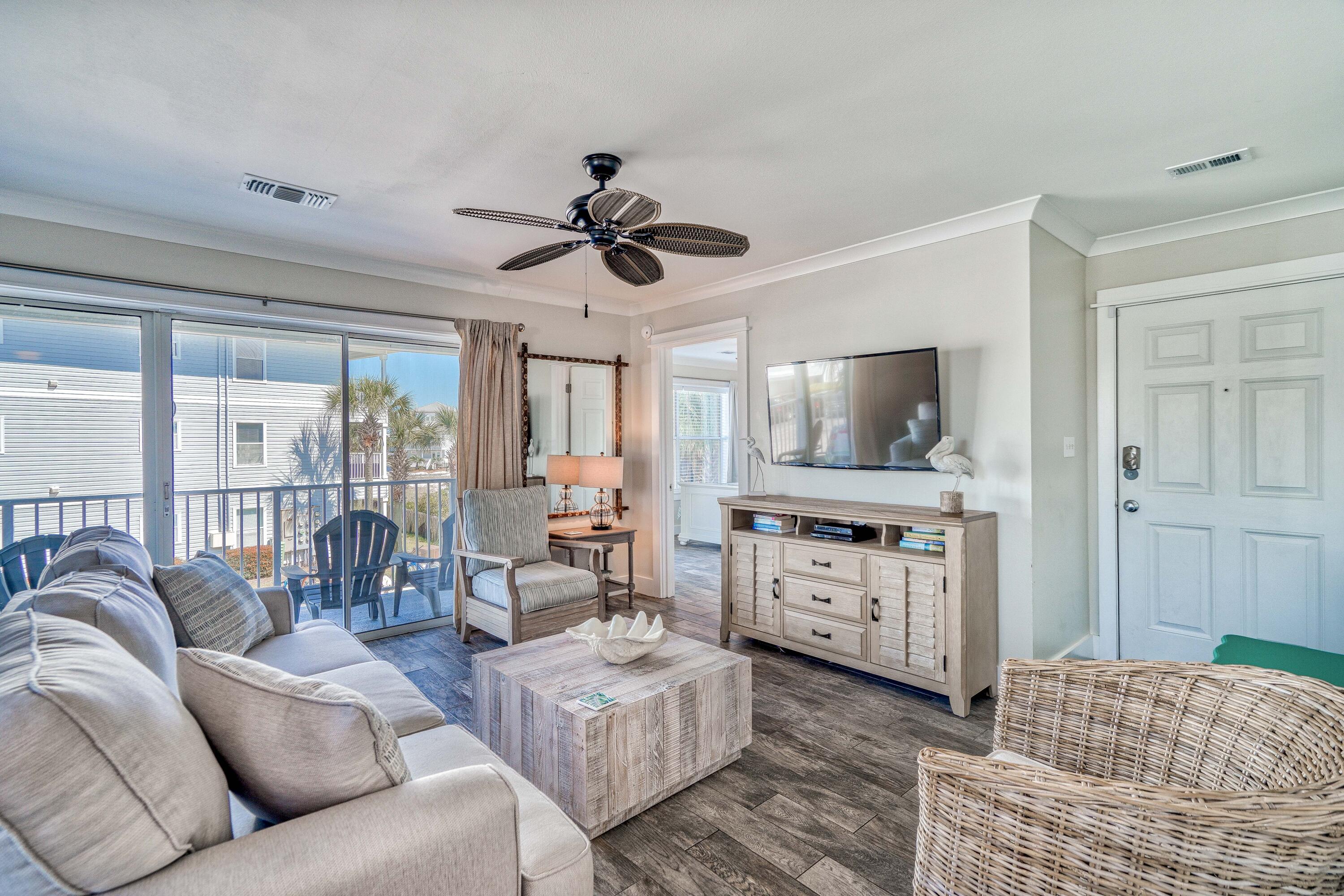 Discover coastal paradise in this 3-bed, 2-bath beach condo! From the spacious living area, an updated kitchen and appliances, and a private balcony for savoring gulf breezes and overlooking the pool. The master suite boasts its own en-suite bath, and two additional bedrooms offer comfort for family or guests. The new interior decor exudes a coastal charm with its soothing color palette, beach-inspired artwork, and tasteful furnishings as of 2022 and new couch on 10/4. Located just steps away from the beach, you can enjoy leisurely strolls in the sand or simply unwinding under the sun. And when you want to explore the local area, you'll find restaurants, shops, and attractions conveniently nearby. New sliding glass doors, windows hardiboard siding, balcony floor redone & new landscaping