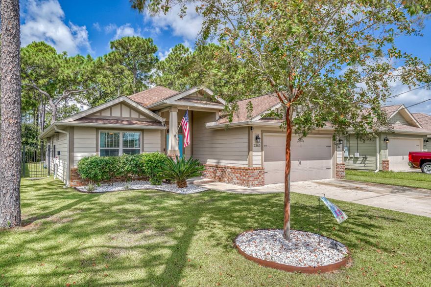 Awesome curb appeal on this Inviting home with open floor plan and top of the line designer finishes. High raised ceiling in family room, wood design tile flooring throughout the living area, crown molding, recessed lighting, and double French doors to patio. The kitchen has a generous dining area, breakfast bar, granite counter tops, Stainless appliances including refrigerator and dishwasher and even pendant lighting. Family & friends will enjoy the oasis and privacy that the custom paver patio provides. The backyard is fenced with custom fence in the back allowing views of the woods and lots of space for kids to play or dogs to run.  This beautiful home is also conveniently located near great schools and is close to the bridge to Navarre Beach and the amazing beaches of the Gulf Coast.