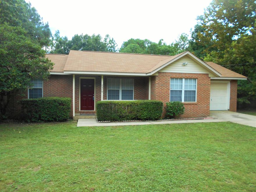 ONE YEAR BUYER'S HOME WARRANTY PROVIDED! A perfect low maintenance home for an investor or a couple just starting out or retiring! Front yard is easily maintained with landscaped bushes, a new mailbox, and a quaint covered porch. As you approach the inviting merlot-colored door, you will see that the roof has been replaced within the last 3 years. The spacious living room leads into the dining room and kitchen, which holds a brand new vent hood along with a large refrigerator and electric stove that are a mere 5 years old. The cabinets have been restained and are large enough to hold all of your essentials. A large laundry room then leads to the 1 car garage. The master bedroom is large with an extended closet containing his and her side doors.