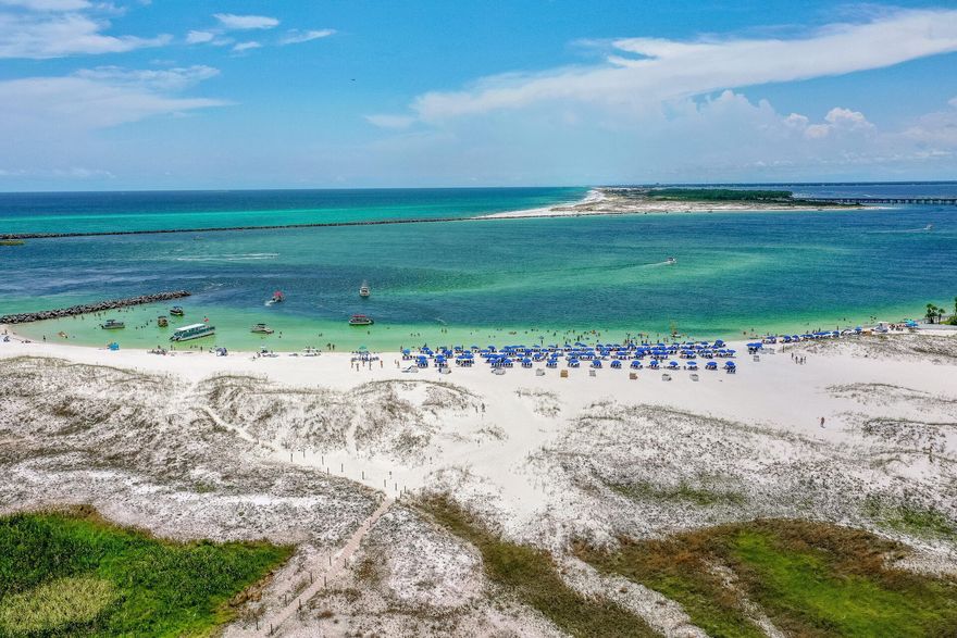 This Condo has AWESOME GULF & PASS VIEWS... AT MAGNOLIA HOUSE, IN DESTIN POINTE One of the last natural and unspoiled, beautiful spots in Destin, Florida. Views abound in all directions that is perfectly located on the 5th floor at Magnolia House, a low rise/low density condominium located among luxury, residential single family homes. Magnolia House is tucked away within the private and gated community of Destin Pointe and offers panoramic views of the Gulf, and the East Pass of Destin with sunrises and sunsets to be enjoyed year round.