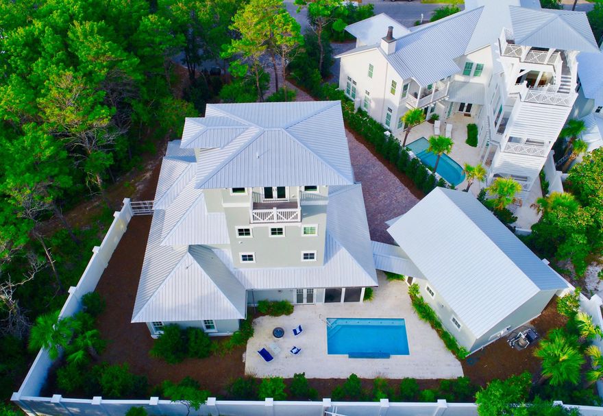 MUST SEE! All new furniture, rental ready for 20+ guests. View this uniquely exquisite home located in Old Seagrove Village on a beautifully landscaped 1/3 acre which offers a quiet retreat while being close to the beach, shopping, restaurants and all the amenities we love on 30A. Take the elevator to the 4th floor to view the Gulf from an air-conditioned tower complete with a wet bar. The ground floor has a stunning entry, separate library, two guest bedrooms, each with private bath, a laundry room and half bath. The master bedroom suite includes two walk-in closets, a master bath with Carrera marble, shower, soaking tub and heated floors.