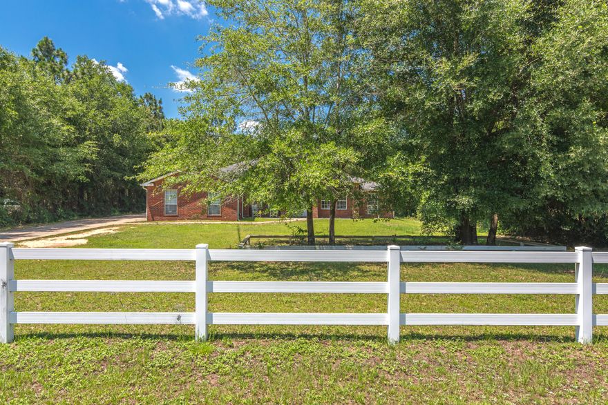 Beautiful Country living on 1 acre! Bring the pets, there is room to roam. A short skip to Duke and Eglin, and zoned for Baker School, this home delivers. Looking for ''THE'' kitchen? Cabinet after cabinet, breakfast bar, island, and countertops that go on and on! Prepare to be awed. 4 large bedrooms feature a split floor plan for privacy. Economical fans grace vaulted ceilings, formal dining area, and open living space. Master bedroom is a retreat, soak in the jetted tub, enjoy the separate shower, and keep sanity with the dual-sink vanity. Linen closets, Walk-in closets, attic space, pantry, garage and yard shed...look no further for storage options. Neighborhood delights with NO HOA, (perfect for the RV!!) and rows of charming white fences.