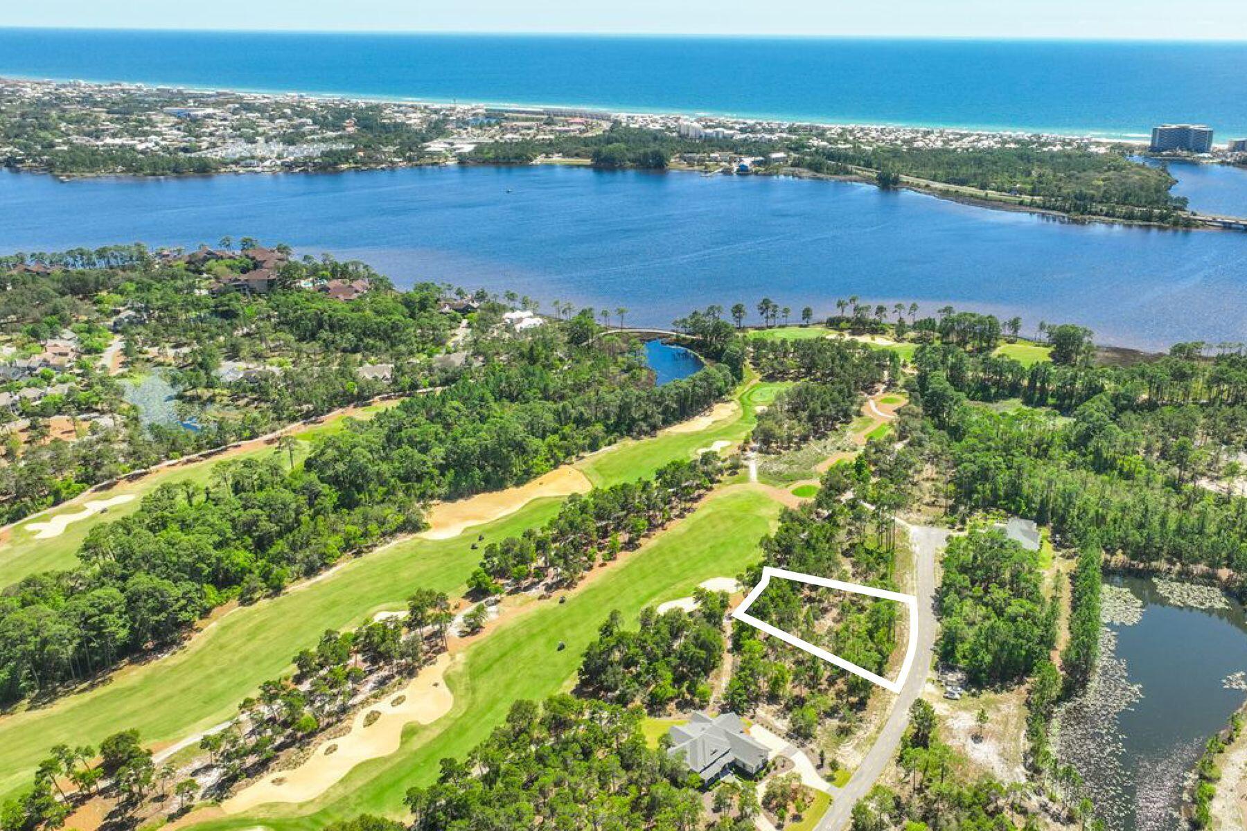 Build your dream home on this premium 0.48-acre ''A'' lot, ideally situated along the 18th fairway of the renowned Shark's Tooth Golf Course in the exclusive gated community of Wild Heron. Nestled on the shores of Lake Powell near Inlet Beach and Panama City Beach, this serene homesite offers peaceful golf course views, no build-out time, and convenient access to the Shark's Tooth clubhouse via a short walk or golf cart ride. Perfect for a primary residence, second home, or investment property, this lot conveys with a boundary, topographical, and tree survey. Wild Heron is a non-rental coastal sanctuary offering exceptional amenities, including a heated pool and hot tub, fitness center, playground, fire pit, and 24 miles of pet-friendly walking and biking trails. Residents also enjoy access to Lake Powell and the white-sand beaches of the Gulf of Mexico. The boathouse is fully stocked with kayaks and paddleboards for easy access to the lake and Camp Helen State Park. Exciting community developments include a new marina with boat slips and a future golf course connecting to WaterSound Origins, further enhancing property value. Wild Heron hosts regular events such as live music, food trucks, movie nights, and farmers markets. Optional memberships are available for the Shark's Tooth Golf Course, WaterSound Beach Club, and tennis center. Ideally located just minutes from 30A, Rosemary Beach, Alys Beach, and Pier Park, this property offers privacy, natural beauty, and convenience.