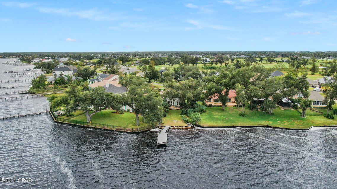 Investors Dream!!!! Waterfront on North Bay!! Amazing sunrises and sunsets from this renovation ready 2 bedroom 2.5 Bath 2 story home on a large lot in the desirable Panama City Country Club! Currently gutted, this home could easily be made into a 3 bedroom! The current floor plan has 2 master suites, one downstairs and the second upstairs. The kitchen overlooks the yard, dock and beautiful North Bay. This Country Club Charmer is ready for your full attention! Roof was Replaced after Hurricane Michael. The spacious yard is large enough to add a pool, perfect for entertaining and watching the beautiful sunsets from your patio, or quickly hop on your boat for a relaxing sunset ride!Don't miss your chance to make this your home!!