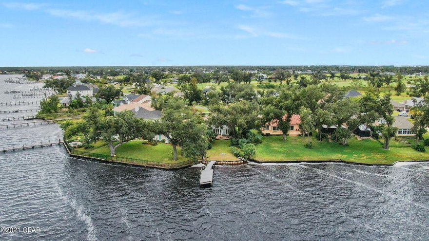Investors Dream!!!! Waterfront on North Bay!! Amazing sunrises and sunsets from this renovation ready 2 bedroom 2.5 Bath 2 story home on a large lot in the desirable Panama City Country Club! Currently gutted, this home could easily be made into a 3 bedroom! The current floor plan has 2 master suites, one downstairs and the second upstairs. The kitchen overlooks the yard, dock and beautiful North Bay. This Country Club Charmer is ready for your full attention! Roof was Replaced after Hurricane Michael. The spacious yard is large enough to add a pool, perfect for entertaining and watching the beautiful sunsets from your patio, or quickly hop on your boat for a relaxing sunset ride!Don't miss your chance to make this your home!!