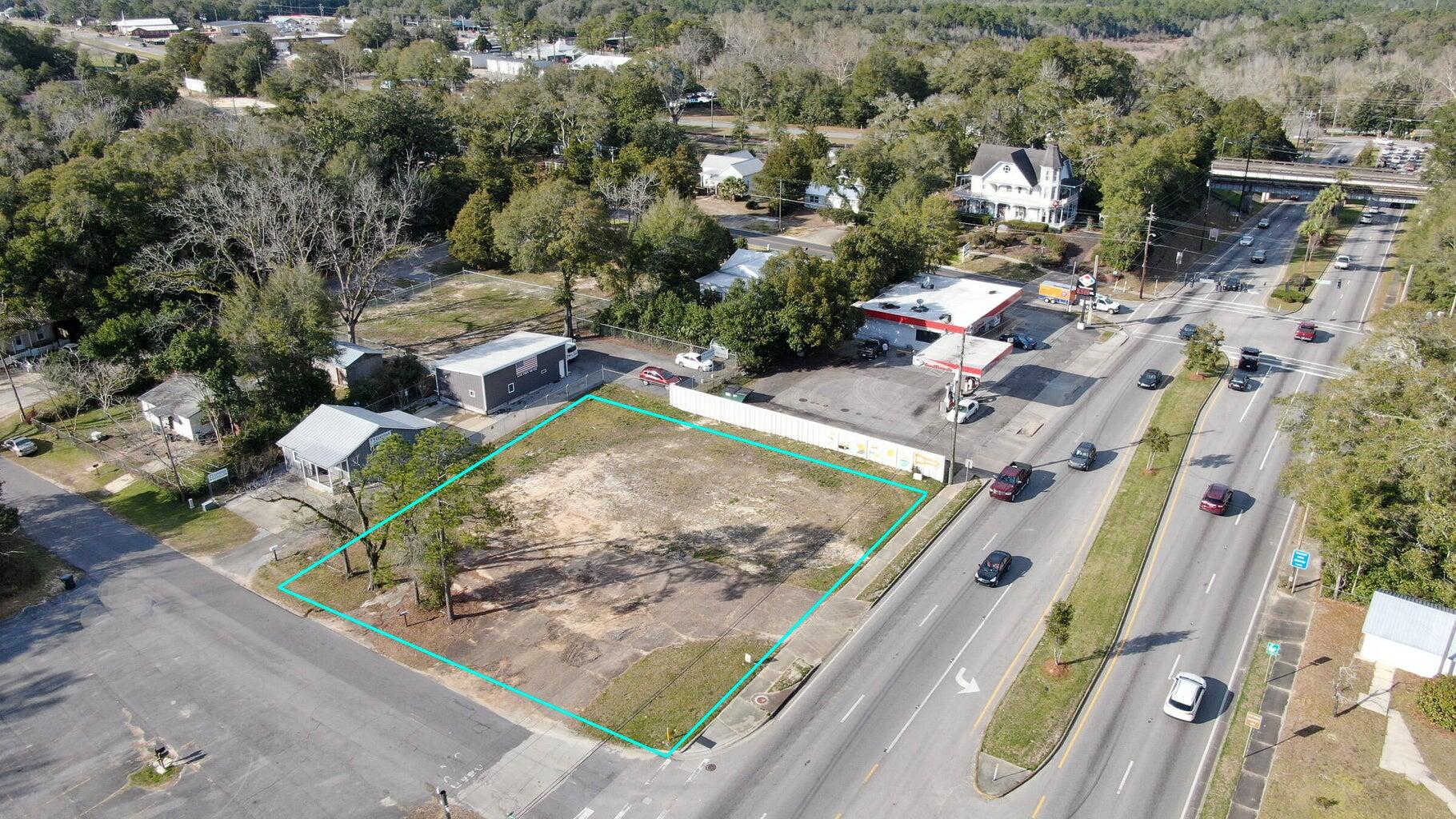 High Traffic. Zoned C2.   High Visibility. 2023 DOT traffic count was 23,500 per day.  Corner parcel on busy Hwy 331, a main corridor used to reach the beaches of South Walton County.  Located in the city limits of DeFuniak Springs.   An old house was located on the parcel. It has been removed.  Now a vacant commercial lot ready for construction. All utilities available including sewer, water, electric & gas.