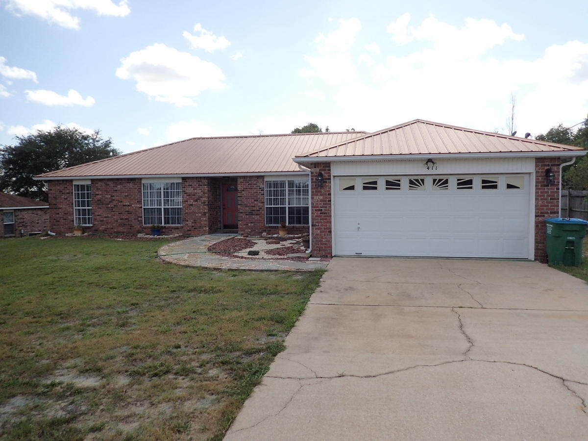 Welcome home! Located in an ever popular and convenient subdivision of PJ Adams in South Crestview, this home is one you will not want to miss. Situated on a level lot, this 2158SF home has split bedroom design and 4 bedrooms and 2 baths. Home has seen lots of updating throughout the home is a must see to truly appreciate! This owner's flair for style and uniqueness certainly makes this home one to see. Home has remodeled baths, kitchen, foyer and dining area. Outside surely not to be missed is the metal roof, all brick exterior, flagstone path way and rock bed and large pavered patio area at the back of the home. Actually park your car in this garage, as this home comes with a large powered workshop for work, play and storage. Call today before this one is gone!!