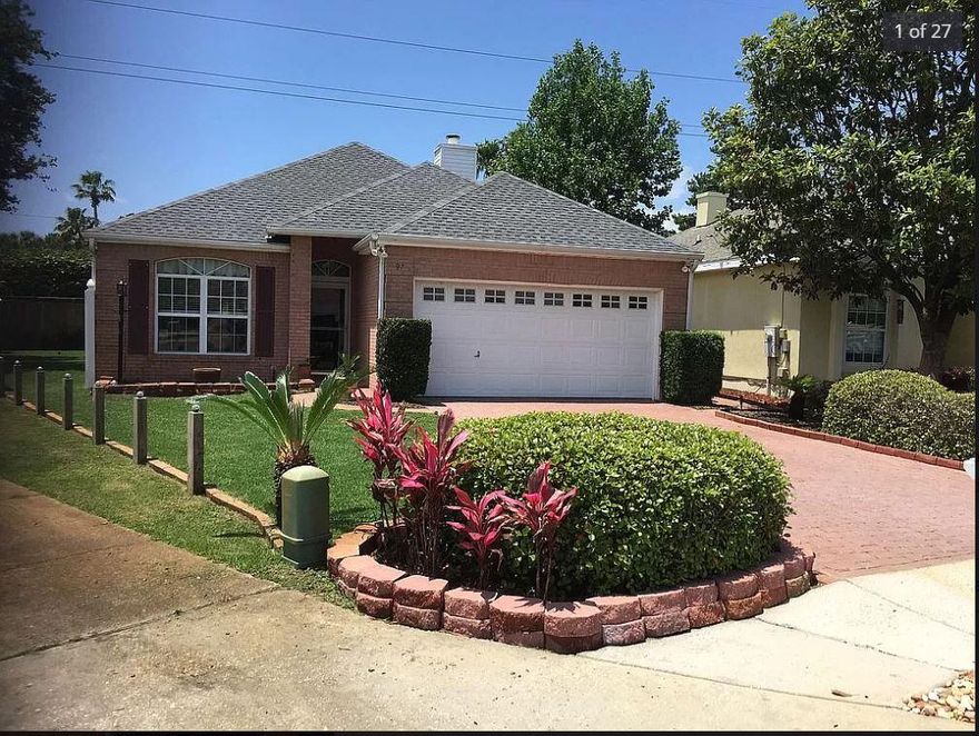 Beautiful traditional brick home on quiet cul-de-sac south of Hwy 98 and close to Destin beaches, shops, and restaurants.  This 3 bedroom 2 bath home has split master bedroom plan with wood and travertine floors throughout.  Kitchen has granite countertops with stainless appliances and includes a washer and dryer.  A large greatroom and dining room with gas log fireplace.  The master bath has a double vanity with garden tub,   shower,  and large walkin closet.  A large covered patio with privacy fence and grass area for kids or pets.  Home has new roof in 2018, a new HVAC and security system in 2022.  Home located in Flood Zone 'X' which does not require flood insurance.  Buyer to confirm all information and dimensions.  No short term rentals. Neighborhood HOA fee only $150 annually