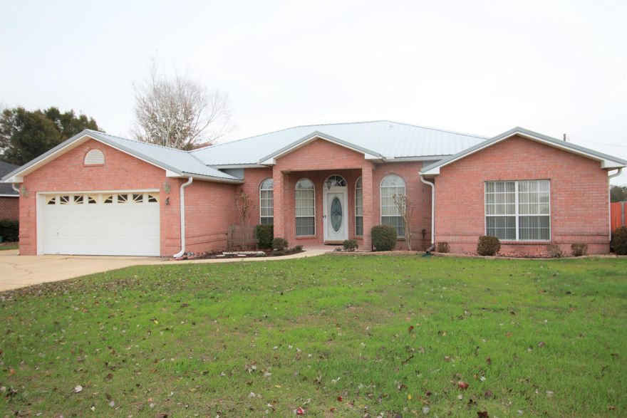 You won't find anything else on the market like this home! This beautifully maintained property is South of I-10 and features 4 bedrooms plus a den, 3 full baths, an in-ground pool, screened porch, and newer metal roof! Located on a large, flat lot in an established neighborhood, this brick home has also been updated with laminate flooring in the living areas, tile in the kitchen and baths, and has additional parking in the driveway! Enjoy entertaining in the spacious living room with vaulted ceilings, out on your large screened-in porch, or in your own backyard oasis with covered patio and a pristine pool! All bedrooms are large with new carpet and the home features plenty of storage. The roof is 2016 and the home has a termite bond. Come check out this wonderful home today!