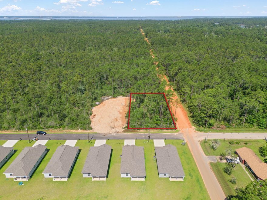 Located in Avalon Beach, minutes from I-10 that helps for an easy commute to Downtown Pensacola and Pensacola Beach, and the Avalon Boat Ramp with direct access to Escambia Bay. This 1/3 Acre, CORNER LOT, can be split into two separate lots or kept whole to build your forever home. Lot is situated on a paved road where there has been much new construction.