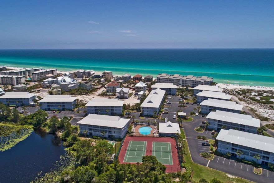 Welcome to Beachside Villas. Conveniently located right off 30A, tucked away in a cozy corner with multiple beach access's nearby, to include a free beach shuttle service in the summer, this is the perfect spot for weekend getaways or a vacation rental. This particular unit faces the Gulf and overlooks 1 of 2 community pools, tennis courts are also on-site.  Bask in the gorgeous sunsets from your spacious back patio. Ample natural light abounds throughout the entire place and the open dining/living areas are perfect for entertaining. The kitchen, which boasts ample cabinet space, is ideal for enjoying a home cooked meal after the beach. The two guest bedrooms are tucked away at the north end of the unit and share a bathroom, aside the laundry room.  Enjoy 30a living at it's best today!