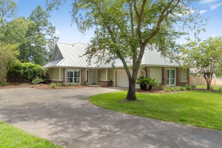 Unique oversized corner lot on Internationally renowned Cory Picko's Ski School lake, South of 98, 1/2 mile from beaches of 30A and Butler Elementary  w/ tremendous potential, no HOA. Lot features a home w/4 Bedrooms and 3 bathrooms.  Upgrades:  bathrooms remodeled 2025, upstairs washer/dryer, metal roof w/ leaf filter gutters installed in 2022, rainbird irrigation system, new pool w/ outdoor area for entertainment as well as an oversized garage w/ extra storage shed. It also has blended features such as ship lap and brick walls as well as brick fireplaces in the living room and Master Bedroom. Full time home or second home w/ short term rental potential, since it is located close to 30A beaches and within an International Water Ski community which opens the possibility for renters.