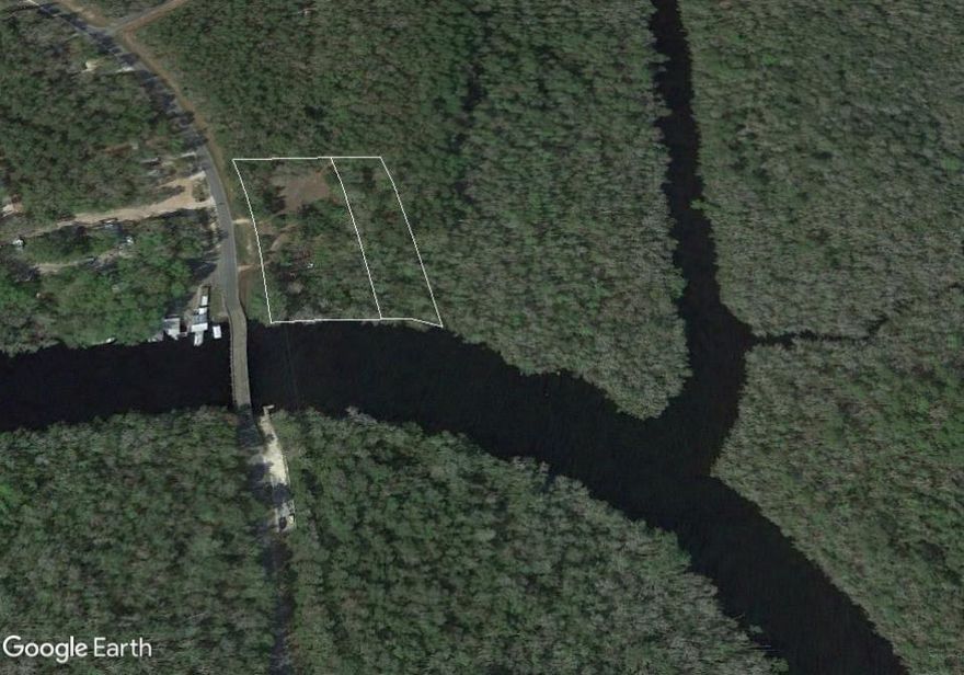 Approx 2.99 Acres - Deep water location with Highway frontage in booming Freeport, Florida is a favorable combination for investors, developers, and business owners. 300 feet on wide, deep waters of Black Creek and 400 feet on Black Creek Road (CR 3280) for excellent public accessibility and waterfront usage. House on property has no value and transfers as is.