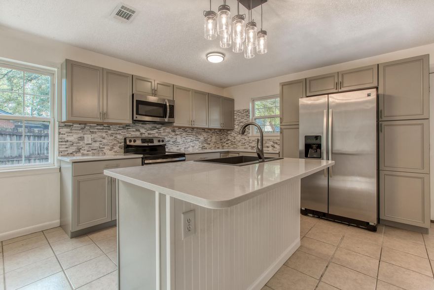 Stunning remodeled kitchen, open living room concept, and huge backyard are some of the few fantastic features of this home! 441 Larkspur Court is the perfect 3 bed/2 bath house centrally located in Niceville, with sidewalks and close proxity to restaurants, shopping and schools. Prepare to be blown away by this gorgeous kitchen with new backsplash, cabinets, light fixtures, stainless steel appliances and quartz countertops. The kitchen opens up to the living/dining room that looks out to the spacious and shaded backyard with an open patio. The home has been recently painted there is a large master bedroom with a walk-in closet.
There is not an HOA, the water heater and HVAC were both replaced in 2019 and 2018 respectively. The roof is 2011 and copper wiring! Don't miss out on seeing this incredible property today!