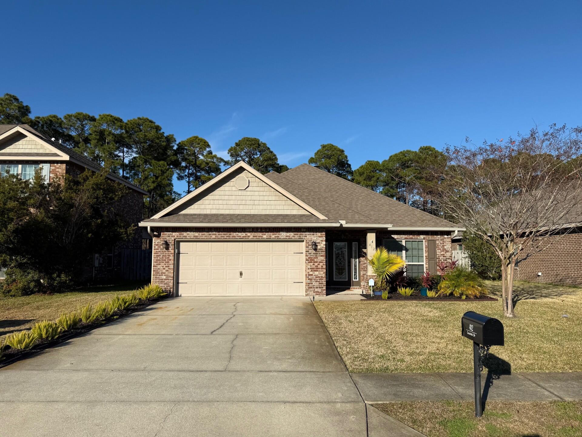 Coastal living in the coveted neighborhood of Driftwood Estates.  This beautifully updated 3 bed 2 bath brick-built ranch is move in ready.  Remodeled kitchen featuring quartz and granite countertops, Italian glass tile backsplash, redone cabinets and all new stainless-steel appliances.  Brand new waterproof LVP hardwood flooring throughout.  The entire interior is freshly painted.  Enjoy the extra-large double shower in the master bath with dual vanities and large walk-in closet.  New light fixtures throughout.  Walk in closets in all bedrooms.  Enjoy the warmth and crackle of a roaring fire in the gorgeous granite fireplace.  Let the screened in back patio lead you to the incredibly large and private backyard oasis with pool, hammock, firepit, citrus trees, and no neighbor behind only natural beauty.  New irrigation system and landscaping with lighting.  Attic above the two-car garage for extra storage and garage is equipped with EV charger.  Home comes storm ready with hurricane shutters.  This incredible home is minutes from the pure white sugar sands of the Emerald Coast, a short walk or bike ride to the bay.  Driftwood Estates has a wonderful 11-acre park with a community room and pool which regularly hosts water aerobics, mat class workouts, food trucks, basketball courts, grills, multi-purpose fields, tennis courts, pickle ball courts, picnic pavilions, a sand filled playground, restrooms, and nature trails. 
Minutes away is Sacred Heart Hospital, Grand Boulevard with fine dining, shopping and family entertainment.  Sandestin's Village of Baytowne Wharf is also very close to this home where more shopping, dining, fireworks, concerts and fun activities are regularly held.  Imagine yourself in this breathtaking Emerald Coast lifestyle.  Schedule your private showing today before it's gone.  All information and measurements are deemed accurate but should be verified by the buyer.