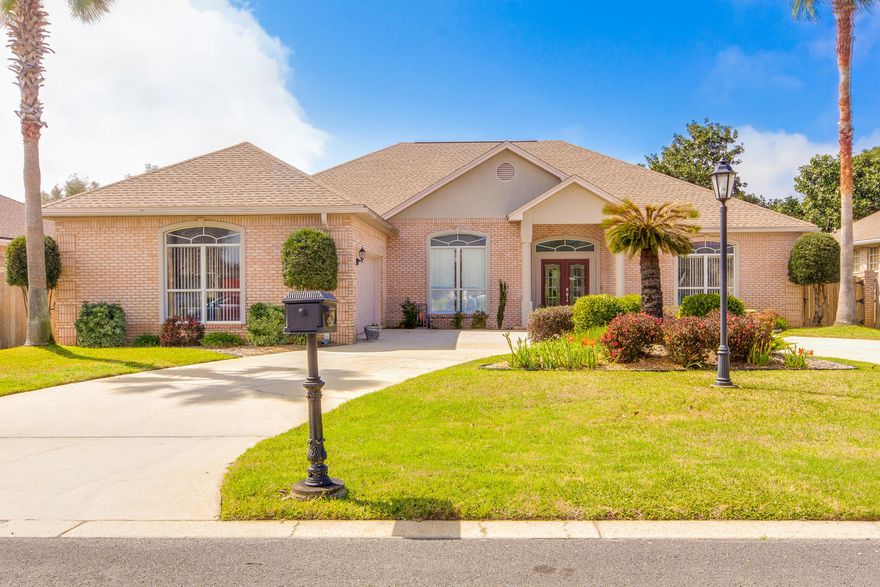 A beautifully renovated 4 bed/3 bath brick home awaits you with a wide-open living, dining, kitchen, and breakfast area. The 2,484 sq. ft. split-floor plan sanctuary welcomes you home with dual master suites, screen-enclosed pool, covered lanai, gas fireplace, and a wrap-around driveway. Come and enjoy your gorgeous new flooring, new granite countertops, new stainless appliances, new custom adjustable and remote controlled LED lighting features, manicured landscaping, and newly painted interior walls and front facade. Relax in your solar-heated swimming pool, freshly tiled walk-in shower with dueling shower heads, or jetted garden tub. Simply open your French Doors to create your own private oasis of indoor/outdoor space. Slip out of your pool and into your 3rd full bathroom using the exterior access door that's just a few steps away. Work comfortably and efficiently from your executive-styled home office (4th Bedroom). Take off down the street on a kayak fishing trip or a paddle board adventure using your deeded access to Santa Rosa Sound. Feel secure with your brand new front door and garage door opener. Are you there yet? Come and visit your new home today! You don't want to miss it...