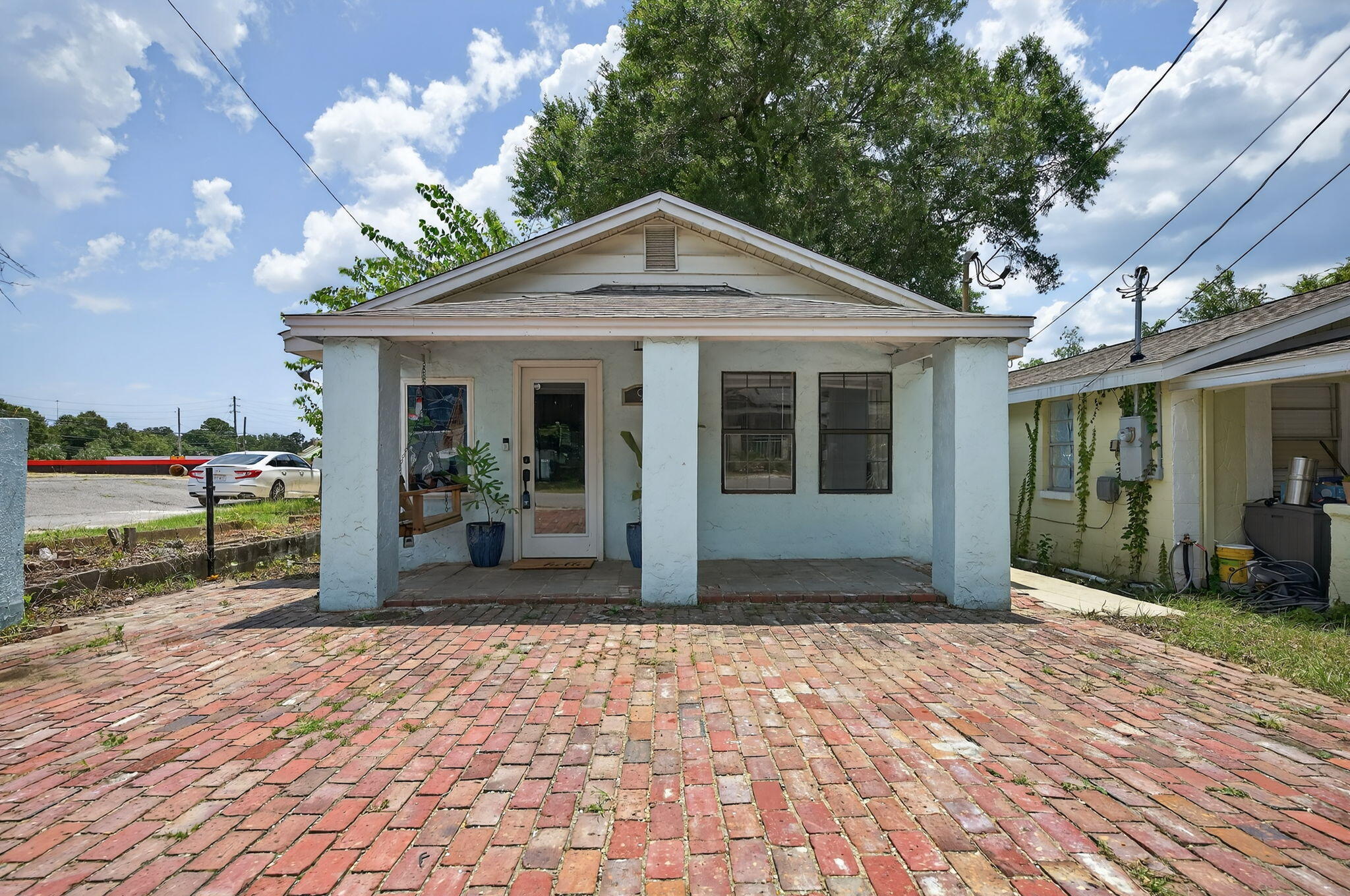 INVESTMENT OPPORTUNITY! Zoned for both residential and commercial use, this unique property offers incredible versatility just off Palafox Street--under 10 minutes from vibrant downtown Pensacola! Whether you're looking for an office, salon or massage space, short-term rental, or primary residence, this 2 bedroom, 1 bathroom home is packed with quality features. Inside is equipped with luxury plank tile throughout and beautifully crafted solid oak interior doors. The kitchen is equipped with white custom cabinetry offering ample storage, granite countertops, and stainless steel appliances--perfect for cooking or entertaining. The bathroom includes a large single vanity with granite countertops and a fully tiled shower equipped with dual rain showerheads. The spacious primary bedroom is tuck ed at the back of the home, offering privacy, two generous closets, and a large window overlooking the shaded backyard. Out back, enjoy the peaceful setting with a privacy fence and a deck. A brick paver driveway provides convenient off-street parking for two vehicles. Located on a quiet street and just minutes from downtown attractions, restaurants, and shops. Come check out this flexible-use property in Pensacola!