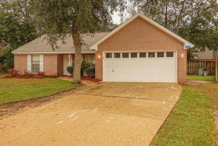 Great all brick Bluewater Bay Blue Pine Village home! Large wooded lot, updated home featuring 3 bedrooms and 2 full baths. Entering the home, you have a focal point brick fireplace with cathedral ceiling in the family room, eat in kitchen with granite, dining room, large master suite with huge garden tub, split floor plan with 2 bedrooms and a bath. Interior laundry room with 2 car garage and large, fenced private back yard with new sod and plenty of space for a pool if you didn't want to make your way to the community pool. Blue Pine Village also features a storage area for your boat or RV with being super close to Bluewater Elementary as well as easy access to the MidBay connector to get anywhere on the Emerald Coast quickly. Call today before this great all brick home is gone!