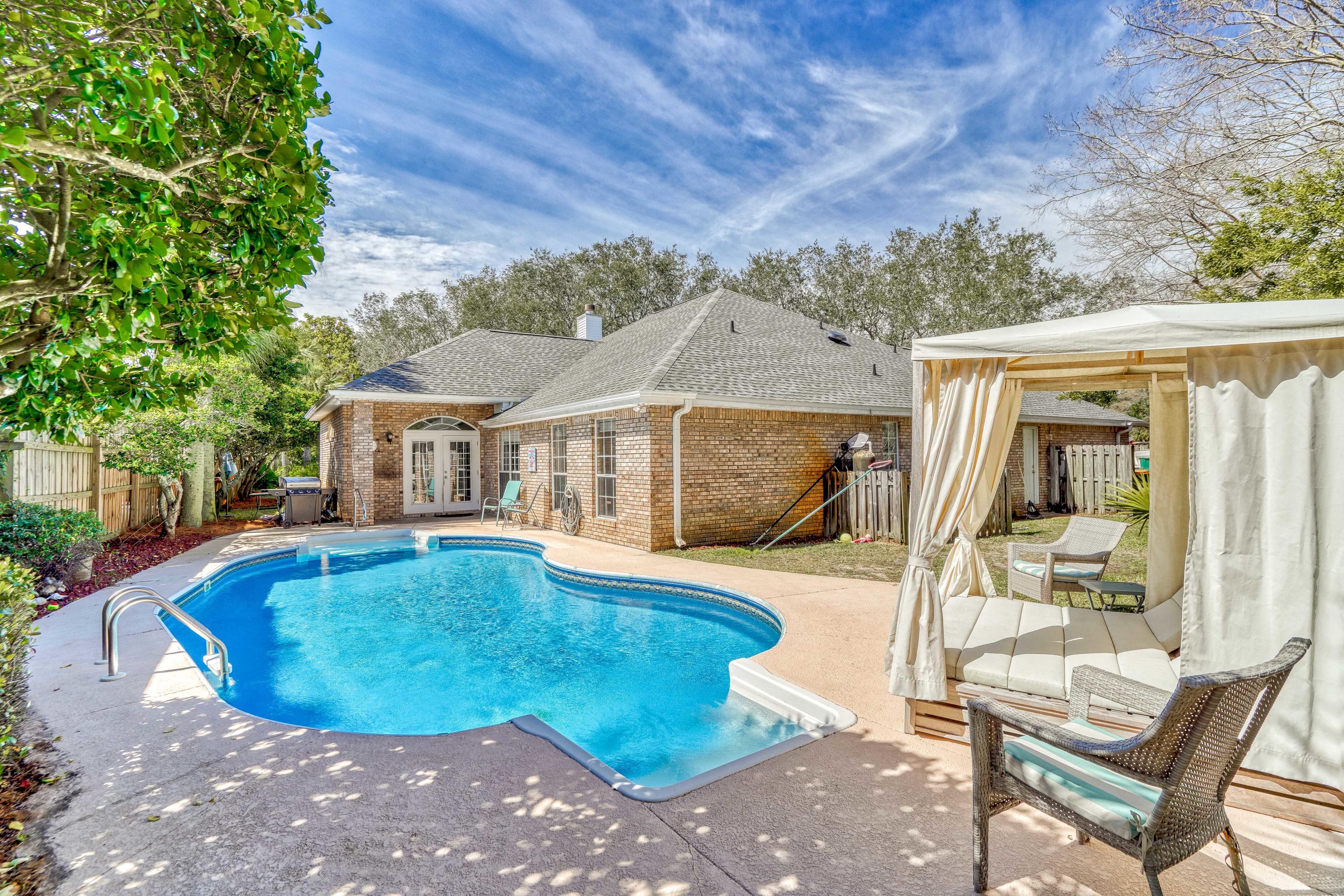 This home is professionaly decorated by Risa's Interiors and comes fully furnished! No carpet! Wood floors run throughout the home with new paint and new backsplash in the kitchen. The home rests at the end of a cul-de-sac on a large lot and includes a very PRIVATE POOL! The split bedroom floorplan is very open and offers lots of natural light. The master suite has TWO ensuite bathrooms, one of which has double vanities, large garden tub, separate shower, toilet room and a large walk-in closet. The second has a shower, toilet room, single vanity & a second walk-in closet. Other highlights of the home are a home office, a whole house generac generator, wood burning fireplace, lush landscaping, large, king bed is a sleep number adjustable $10,000 mattres