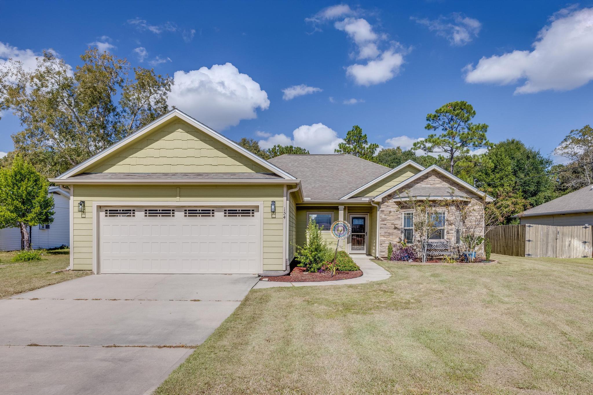 Welcome to this inviting 3-bedroom, 2-bathroom pool home located in Crestview. Built in 2015, this single-story home is nestled on a generous half acre lot, offering space and privacy. The home features vaulted ceilings and durable plank flooring throughout, with large bedrooms.The kitchen is designed for both functionality and style, with plenty of cabinet space and a large pantry. The master suite includes a large bathroom with a walk-in closet.Step outside to find a screened lanai leading to an in-ground pool, ideal for relaxing or entertaining. The enclosed patio and expansive backyard make this property perfect for outdoor activities. Additional conveniences include an attached 2-car garage and shed with electricity. The home is in close proximity to Crestview's local amenities and a 33 minute drive to Eglin Air Force Base. To top it off, the home is located outside the city limits and offers county taxes! 