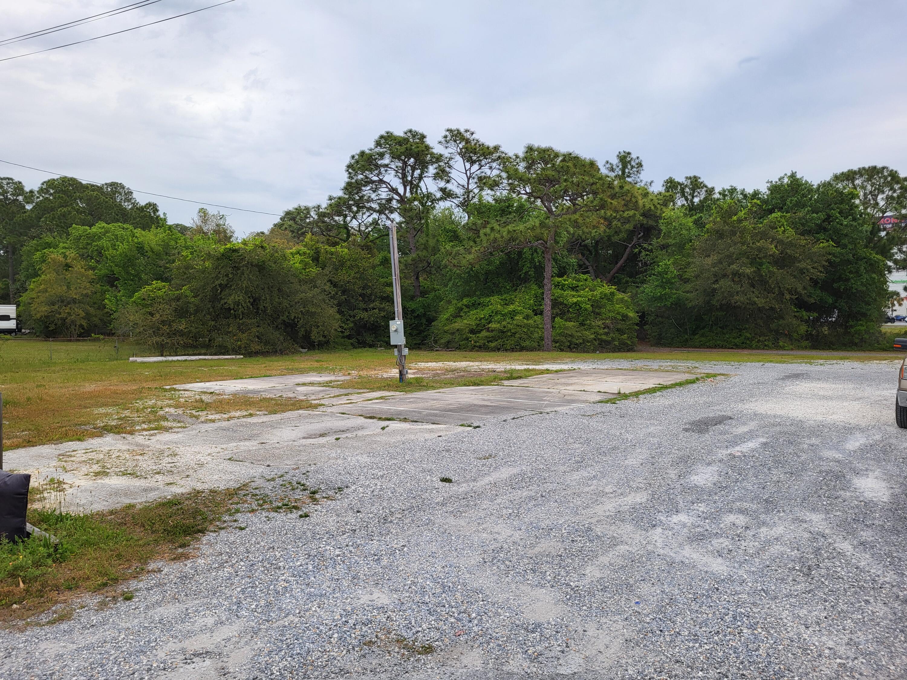 Lot for lease for Food Truck/Trailer, used car lot, or storage lot. Has electrical pole with two 50 amp plugs and water. This is a location for 2 food trucks at $1,500 each. Located west of Walmart and east of Aldi's. Property has an existing median crossover so traffic heading both ways can access site.