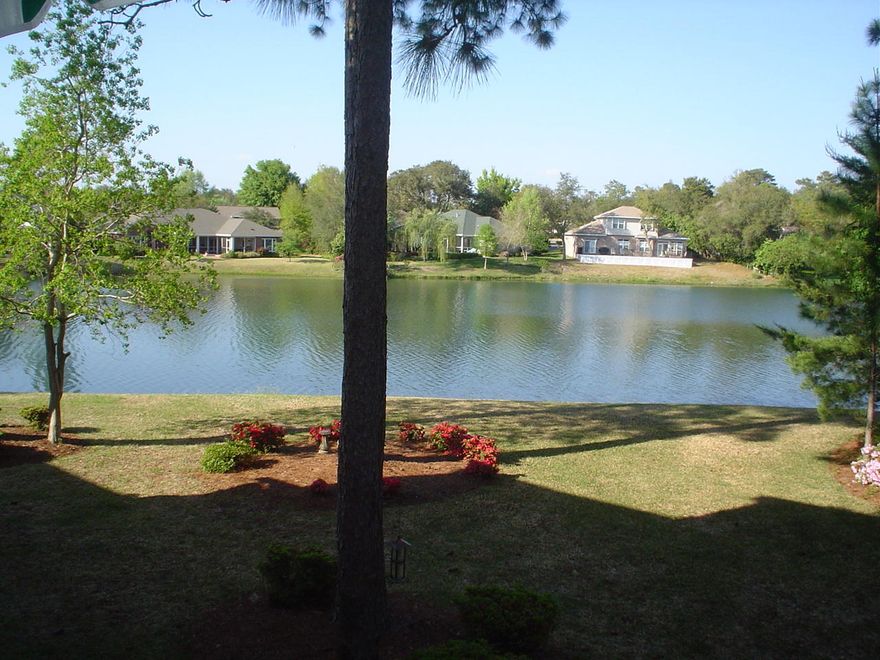 Picture perfect is the setting of this attractive, very well maintained end unit condo which is on the point of one of the largest lakes in Bluewater. The charming interior has warm colors, and wood (pergo) flooring on the first floor. The design and color scheme of the step saving kitchen, with it's tile countertops, smooth surface stove top/oven, built in microwave, refrigerator with ice makes and a stacked washer/dryer. Spacious great room with dining area open onto a covered deck/porch so you can enjoy the peaceful panoramic view of the lake. Bedroom and bath on the first floor and a larger bedroom/loft with bath on the 2nd floor. Sorry but we can not accept pets or allow smoking in the condo or on the deck. Tennis & Pools for you to join for a monthly fee within walking distance.