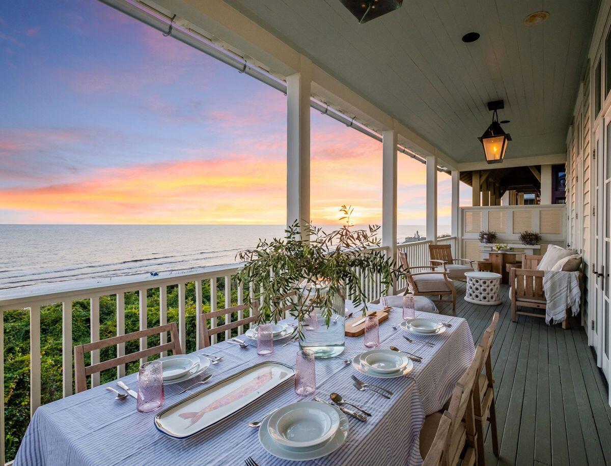 Pristine architectural styling and exceptional highly curated interiors by Ashley Gilbreath Interior Design characterize this prominent Gulf front home primely positioned in a prime corridor of Rosemary Beach. Presiding over 66' of linear beach frontage, this compound property is a rare estate sized home ideally situated to enjoy the surrounding new urbanism lifestyle along the east end of 30A while yielding exemplary privacy from the walled courtyard facade of this remarkable retreat. Proudly yielding over 3,600 sqft of heated living space including a separate carriage suite, this fully remodeled five bedroom, five and a half bath masterpiece is thoughtfully configured as a multi-generational estate with optimal living arrangements.