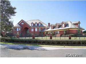 ''This Estate Home is being sold via a Live Auction to be held on Thursday, December 5, 2019. The List Price is the Minimum Bid Price at the Auction plus a 10% Buyer's Premium.''. Situated on 1.6 acres in the Preserve on the Bay. Most prestigious address in Bay County. Ultimate Security (9 foot electronic gates within the gated community) 90 zone security system with 13 Streaming and recorded video cameras. 11'2 ceilings through the home. The Grand Entrance is custom glass inlaid with brass casing. Imported and hand crafted Brazilian Mahogany. 3 cm solid marble tread and stairs. Over $550,000 in custom wood trim and cabinetry. A music room with soaring ceilings. A Ballet Room, sunken living room with couffered ceiling and alabaster lighting. Tennis Court, Swimming Pool, hot tub, and four