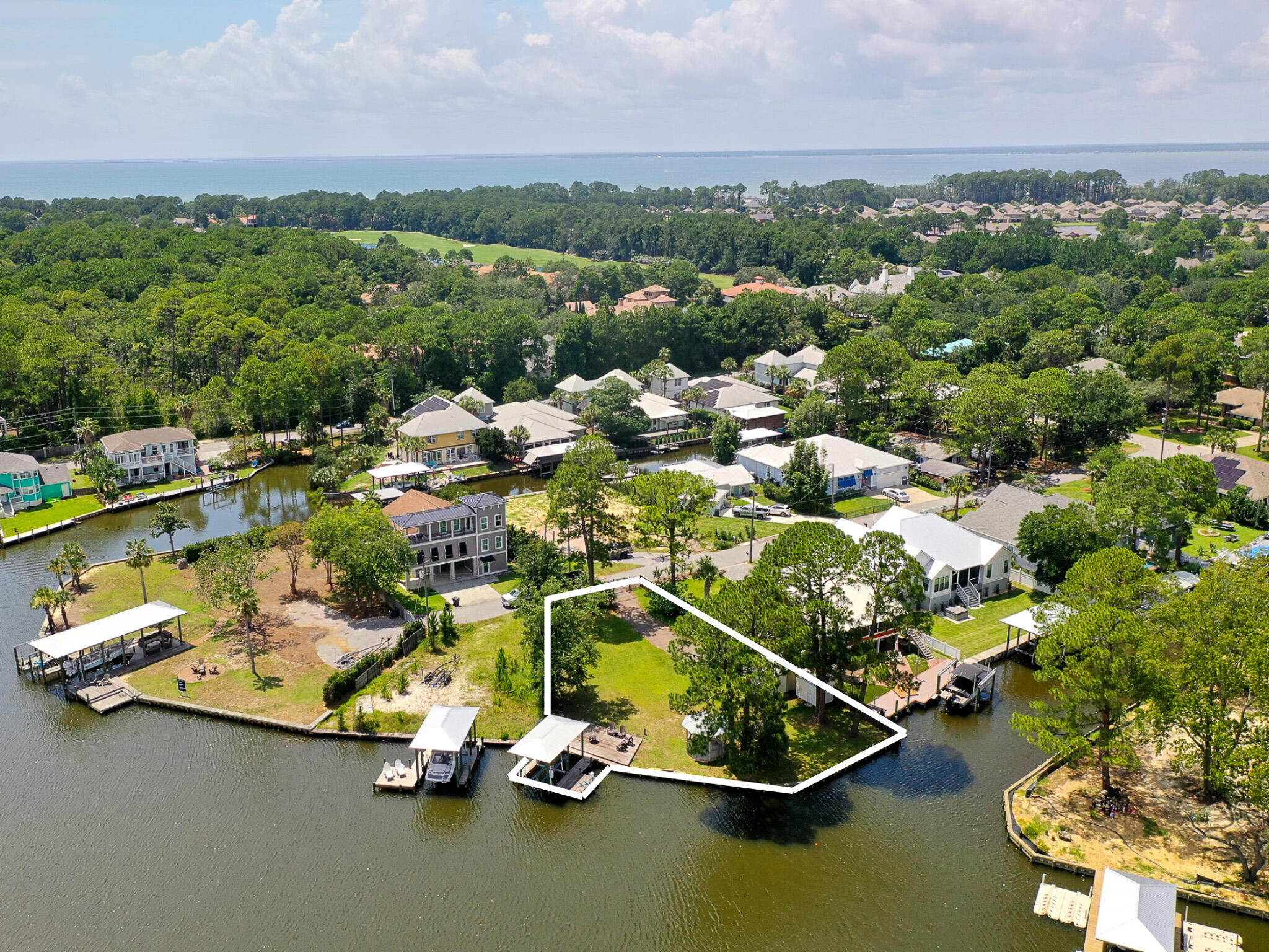 Positioned along Buck Bayou in the heart of Santa Rosa Beach, 83 Anchor Lane presents a rare opportunity to create a bespoke waterfront estate within a discreet enclave north of 30A.Set on nearly half an acre, this premier homesite offers generous dimensions and exceptional frontage with direct deep-water access - ideal for boating enthusiasts seeking the option to add a private dock and lift. Surrounded by distinguished estate properties, it maximizes navigability to Choctawhatchee Bay while capturing the natural beauty of the bayou.Hidden Harbor is an intimate, unrecorded subdivision that offers privacy and tranquility while remaining moments from Sandestin Golf and Beach Resort, Grand Boulevard, and the region's premier dining, shopping, and white sand beaches. Framed by mature native foliage, the setting is both secluded and scenic, providing the perfect canvas for a legacy waterfront build. Public utilities are available, and there are no build-out time requirements, ensuring design flexibility without compromise.
For those seeking scale, access, and an exceptional location to create a refined coastal retreat, 83 Anchor Lane embodies the ultimate in bayfront living along Northwest Florida's Emerald Coast.