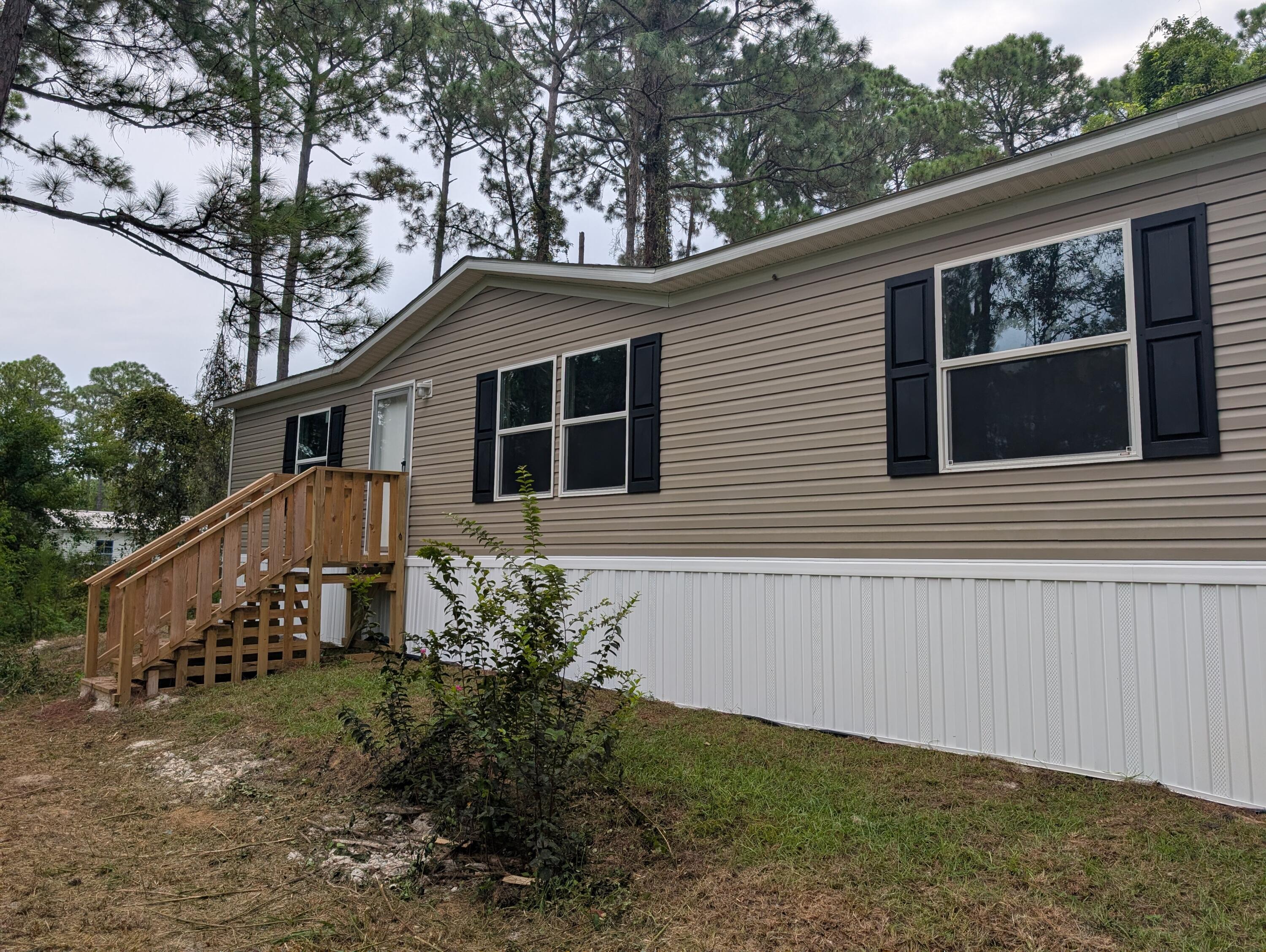 Brand New Manufactured Home on a Double Lot in Santa Rosa Beach, FLExperience the best of coastal living and convenience in this brand new manufactured home. Situated on a generous 100' x 125' double lot, this property offers an exceptional opportunity for a peaceful lifestyle with plenty of room to expand.This home's location is a boater's and beachgoer's dream. You'll be just 1 mile from a public boat launch on the bay, providing easy access to the water for a day of fishing, kayaking, or boating. The stunning white sand beaches of Santa Rosa Beach are only 3.5 miles away, making spontaneous beach trips a breeze. Prime Location! Brand New Manufactured Home on a Double Lot in Santa Rosa Beach, FL
Experience the best of coastal living and convenience in this brand new manufactured home, the Satisfaction TRU2848R. Situated on a generous 100' x 125' double lot, this property offers an exceptional opportunity for a peaceful lifestyle with plenty of room to expand.
This home's location is a boater's and beachgoer's dream. You'll be just 1 mile from a public boat launch on the bay, providing easy access to the water for a day of fishing, kayaking, or boating. The stunning white sand beaches of Santa Rosa Beach are only 3.5 miles away, making spontaneous beach trips a breeze.
With 1,264 square feet of living space, this 3-bedroom, 2-bathroom home features an open floor plan that connects a spacious living room, a separate dining area, and a functional kitchen with a convenient island. The primary bedroom is a true retreat, complete with its own private bath and a generous walk-in closet. Two additional bedrooms and a second full bathroom provide ample space for family or guests.
This home is not only a fantastic find but also puts you in a highly desirable location close to everything Santa Rosa Beach has to offer. Enjoy a wide variety of local shopping, world-class dining, and entertainment options just a short drive away.