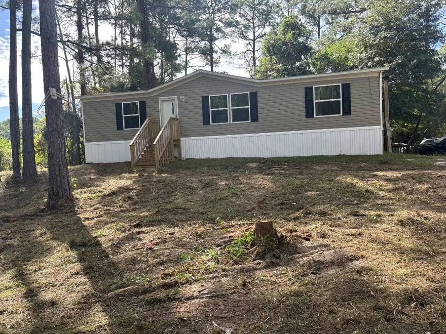 Brand New Manufactured Home on a Double Lot in Santa Rosa Beach, FLExperience the best of coastal living and convenience in this brand new manufactured home. Situated on a generous 100' x 125' double lot, this property offers an exceptional opportunity for a peaceful lifestyle with plenty of room to expand.This home's location is a boater's and beachgoer's dream. You'll be just 1 mile from a public boat launch on the bay, providing easy access to the water for a day of fishing, kayaking, or boating. The stunning white sand beaches of Santa Rosa Beach are only 3.5 miles away, making spontaneous beach trips a breeze. With 1,264 square feet of living space, this 3-bedroom, 2-bathroom home features an open floor plan that connects a spacious living room, a separate dining area, and a functional kitchen with a convenient island. The primary bedroom is a true retreat, complete with its own private bath and a generous walk-in closet. Two additional bedrooms and a second full bathroom provide ample space for family or guests.

This home is not only a fantastic find but also puts you in a highly desirable location close to everything Santa Rosa Beach has to offer. Enjoy a wide variety of local shopping, world-class dining, and entertainment options just a short drive away.