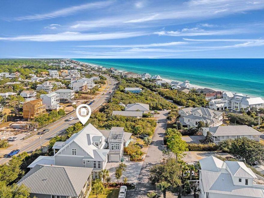 Priced to Sell! Projected gross income of $370,000. Currently rented a portion of the year.Introducing a rare opportunity for discerning investors seeking a stunning estate that embodies coastal opulence and proven rental income potential. This tri-level estate boasts mesmerizing 180 gulf views from the second and third floors, and roof top deck!Positioned just two minutes from Beach Highlands neighborhood deeded beach entrances with 1,000 feet of beachfront. This incredible residence features seven  bedrooms and seven and two half bathrooms, including a detached carriage house above the garage. Indulge in resort-style living with a state-of-the-art kitchen, complete with a wet bar, wine storage, and two high performance kitchen.

Ascend to the rooftop sundeck and revel in panoramic views of the glistening Gulf waters. A private elevator, and an expansive outdoor oasis with pool side linear fire place, spa, recessed sun loungers in pool platform; outdoor designed for entertainment and relaxation. Unwind in style at the swim-up bar, savor outdoor meals from the gourmet outdoor kitchen, and bask in the sun on sleek poolside chaise lounges.

Entertaining is made easy with a Sub Zero 48'' refrigerator, Wolf SS 48'' dual fuel gas range, custom vent hood, convenient pot filler and coffee station. The opulent kitchen island with its waterfall marble countertop provides added seating. Step from this area through gorgeous Euro doors into a large, covered lanai bringing the outdoors in with a lovely transitional area with a resort style pool, incorporated hot tub and waterfall feature that flows into the shallow area with sunbathing ledge. 

It's an easy stroll through the pool or swim up to the submerged bar seats that adjoin the bar and sunken outdoor kitchen. The stunning outdoor kitchen comes with a BBQ grill and Big Green Egg, soda cooler, ice maker and sink. After an evening swim, gather by the lovely, modern fire pit. Finally, retreat for relaxation in the primary king suite featuring french doors that open to the lanai and a sumptuous ensuite with a double spa shower and soaking tub. 

This floor also hosts an additional queen bedroom. Serene colors, calming textures, shiplap accents, designer lighting, and natural wood elements continue throughout the home. The second-floor wraps guests in luxury with three king bedrooms; each featuring its own private ensuite baths. One bedroom includes a small workout room with Peloton. The third and final level of the main house features a capacious family Room with a queen sleeper, covered porch access, and crisp white Bunk Room featuring two twin over twin Bunks with a shared bath/shower combination. The third level offers a private office suite with full kitchen and bath that could be converted to a seventh bedroom. Whole house GENERAC generator.

Currently on Echelon's rental management program with a proven track record of income and room for more. All furnishings to convey.