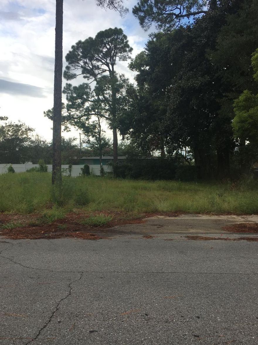 commercial lot with potential flexibility;Area with numerous new businesses and new construction .note Property apprisers site has wrong dimension - 71x100 should be correct.used before as a duplex/ multi-family that burned down.Numerous uses for Businesses, multi-family etc.buyers to satisfy themselves of all codes and zoning restrictions .as is sale.