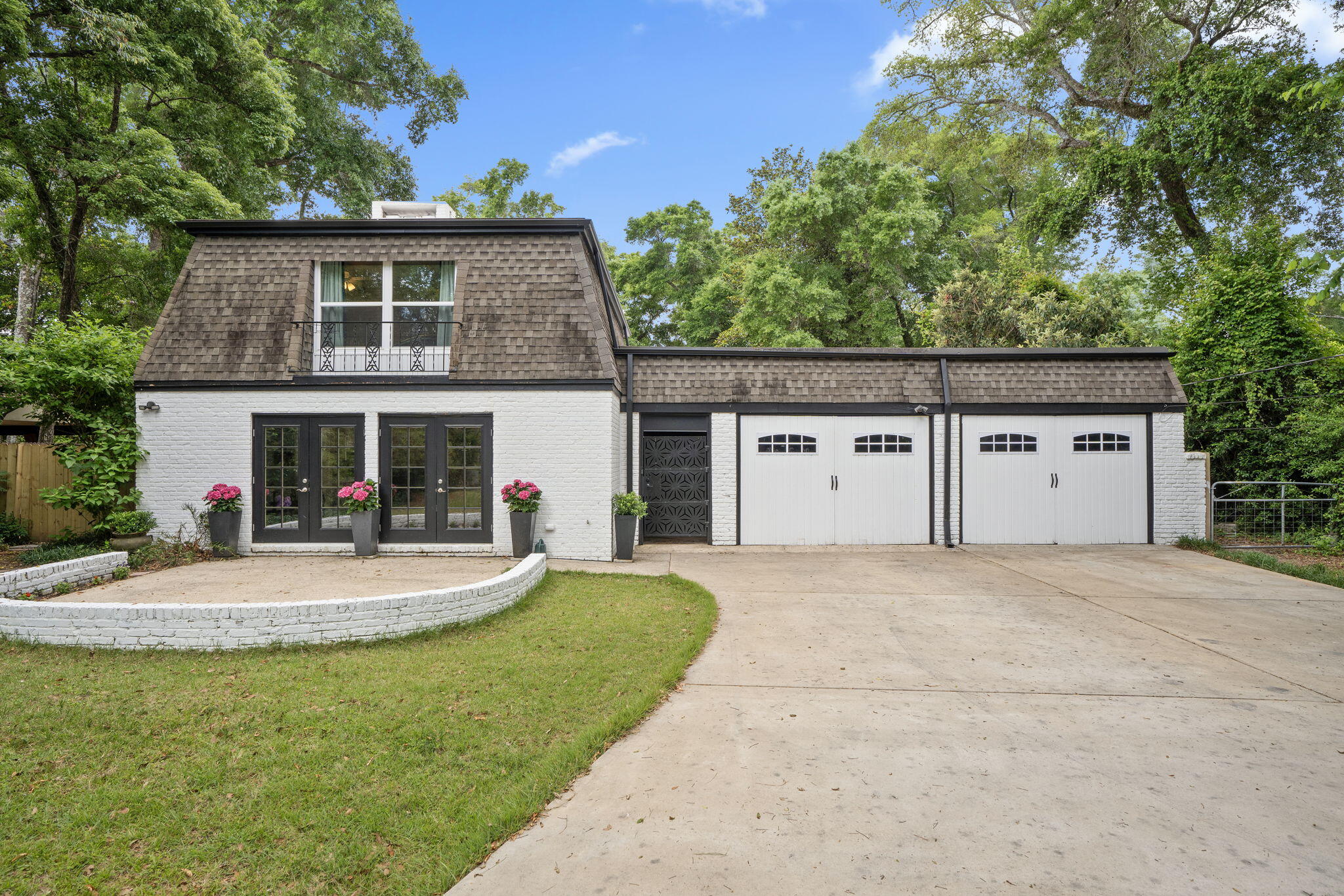 Welcome to 9955 Noriega Drive, a stunning Pensacola gem with over $100,000 in updates that beautifully blend modern comfort and timeless charm. This spacious 3,750 square foot home sits on an expansive 0.83 acres, offering plenty of room to relax and entertain. Step inside to discover four generously-sized bedrooms and three updated bathrooms, featuring a tasteful mix of tile and laminate flooring throughout. The exposed brick accents add a touch of character, while the central heating and air conditioning ensure year-round comfort. The bright and airy living spaces are perfect for gatherings, and the newly added concrete driveway leads to convenient parking options. Outdoors, you'll find your own private oasis with a pool, hot tub, and ample private outdoor space, making it ideal for hosting summer barbecues, or simply taking time to unwind. Don't miss the opportunity to call this beautifully renovated home your own!