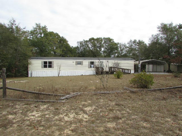 *EQUAL HOUSING OPPORTUNITY* Plenty of room to roam! Enjoy country living from the back deck and the front porch. Over sized living room is light and bright with vaulted ceilings. Steps away is the dining area that leads to the large kitchen. Tons of cabinetry, custom light fixtures and a breakfast bar perfect for the morning coffee!!! The master suite is light & bright and spacious. Storage is abundant with closet space, outbuilding and carport. Fall in love with the amazing privacy! Minutes from local lakes and parks for fishing and plenty of outdoor activities. Short distance to Blackstone Golf Course and Hwy 10.