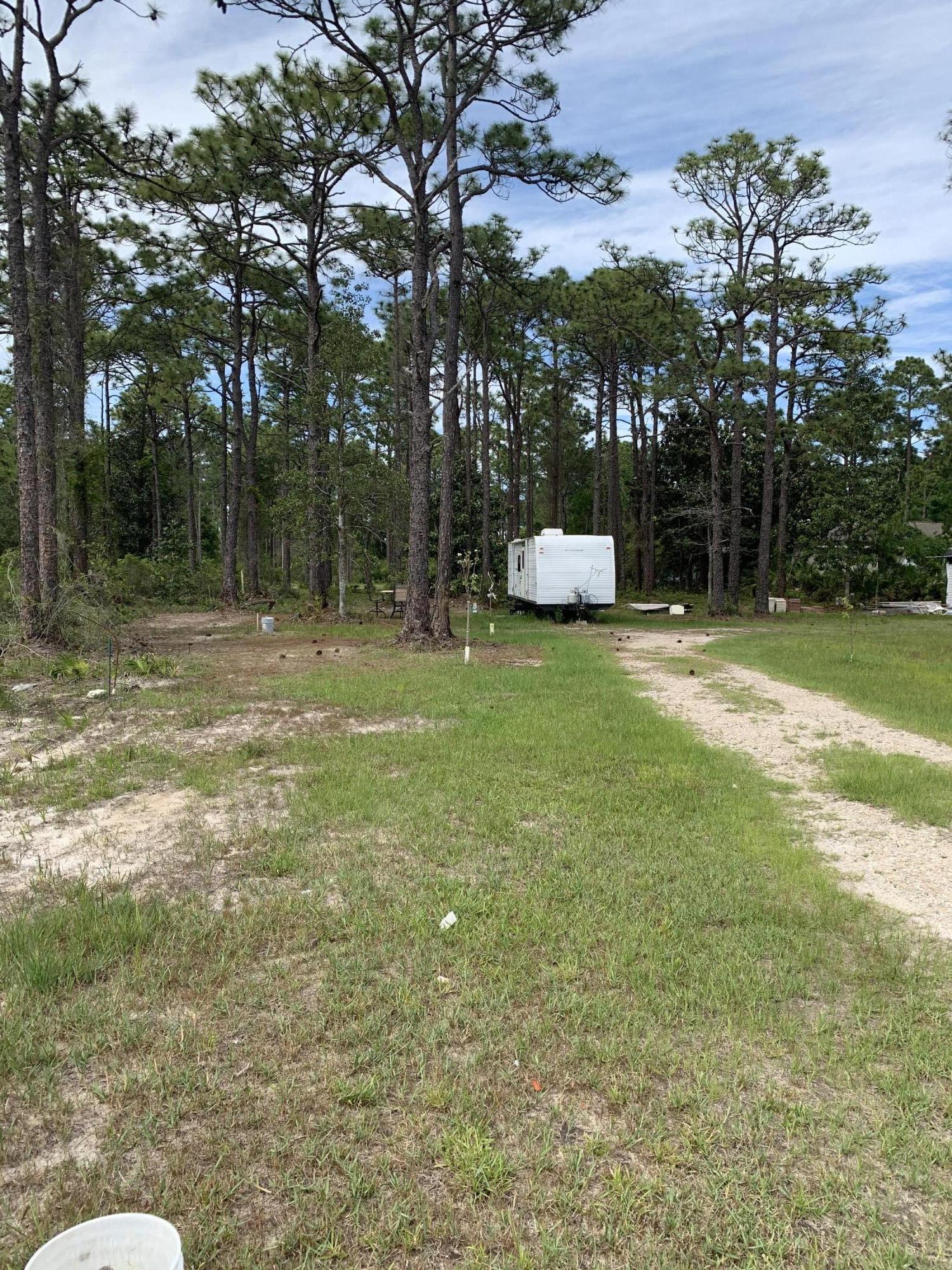 Buildable lot off West Hewitt Road conveniently located near great shopping and schools. Although this lot contains wetlands, the Northwest corner contains uplands and is suitable to building. This lot may also be ideal for building and landscape contractors looking for a lot to store or stage their equipment. Pole barn allowed. Zoned conservation residential per county. 2 units per acre. Zoning language in MLS documents. Buyer to verify all dimensions and information within this listing.
