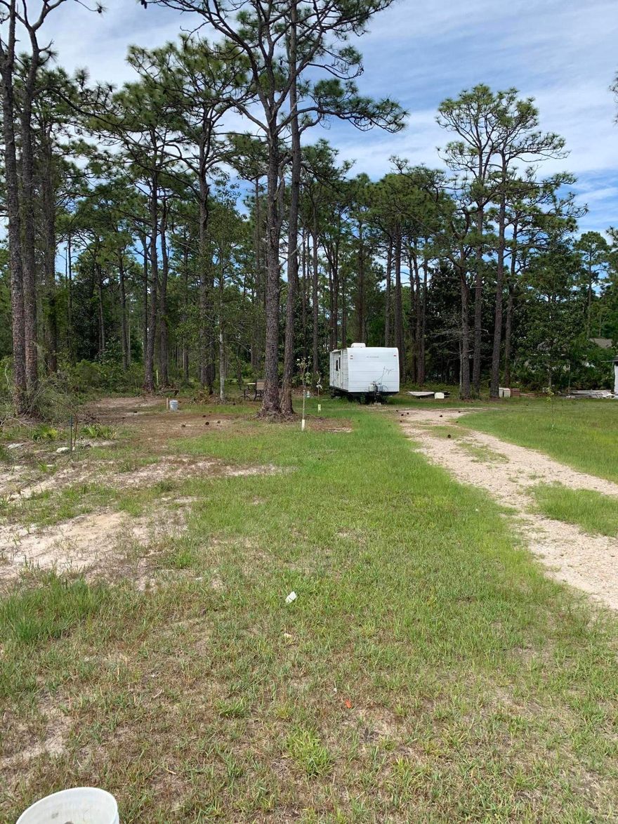 Buildable lot off West Hewitt Road conveniently located near great shopping and schools. Although this lot contains wetlands, the Northwest corner contains uplands and is suitable to building. This lot may also be ideal for building and landscape contractors looking for a lot to store or stage their equipment. Pole barn allowed. Zoned conservation residential per county. 2 units per acre. Zoning language in MLS documents. Buyer to verify all dimensions and information within this listing.