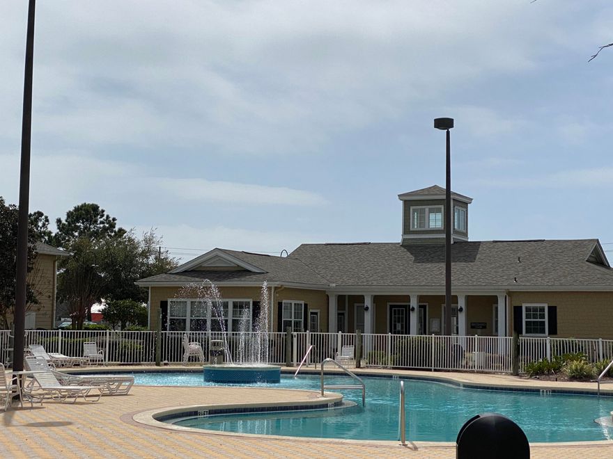 A 4 bedroom under $300k in PCB!  This one-owner second-floor one-level condo has never been rented and is in fantastic condition; three bedrooms saw almost no use.  This condo would make a great home, second home or long-term rental.  NO short-term rental allowed.  Just a few blocks from the beach and near many restaurants and shopping.   Located on the quiet courtyard side of the building, you can enjoy peaceful living while still being very close to the beautiful community pool, clubhouse and playground.  Charcoal grills are available for use and located very near the front door.  Condo comes with one parking space with adjacent overflow parking.    Carpet is brand new, High efficiency HVAC 2015, 1-year old refrigerator and washer/drye