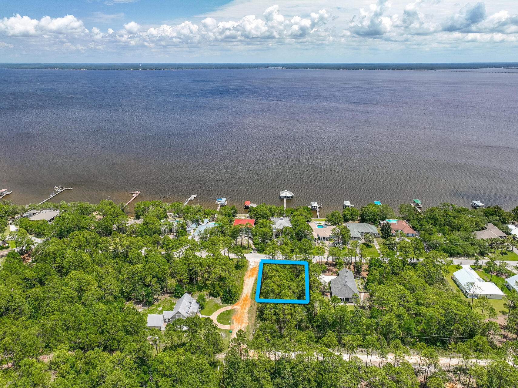 Build your dream home on this 0.25-acre lot, located just minutes from the renowned 30A area. Imagine the ease of living just over half a mile from the serene Kellogg Park, perfect for peaceful walks and waterside picnics. Boating enthusiasts will appreciate being only 3 miles from the Cessna Landing boat launch, offering effortless access to the water. The pristine beaches, a mere 5 miles away, provide endless opportunities for sun and fun. This prime location offers the best of coastal living, blending a vibrant lifestyle with natural beauty. Create your personal paradise in this coastal community.
