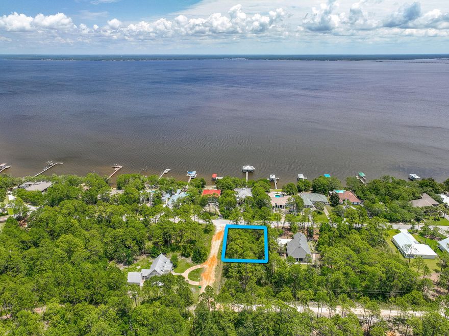 Build your dream home on this 0.25-acre lot, located just minutes from the renowned 30A area. Imagine the ease of living just over half a mile from the serene Kellogg Park, perfect for peaceful walks and waterside picnics. Boating enthusiasts will appreciate being only 3 miles from the Cessna Landing boat launch, offering effortless access to the water. The pristine beaches, a mere 5 miles away, provide endless opportunities for sun and fun. This prime location offers the best of coastal living, blending a vibrant lifestyle with natural beauty. Create your personal paradise in this coastal community.