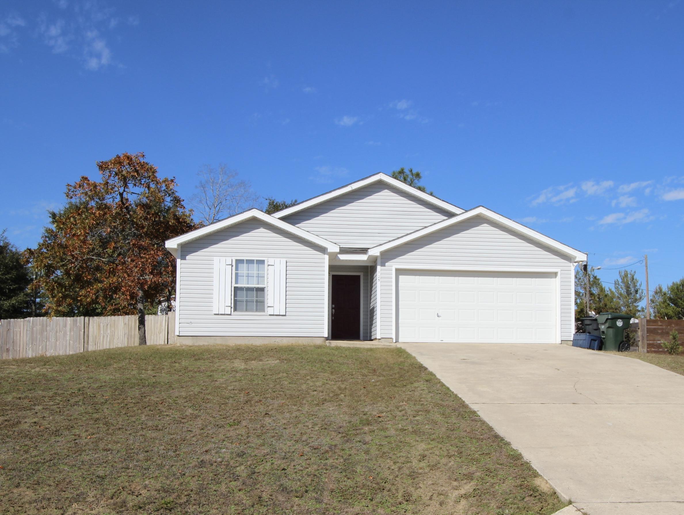 This neat and clean split floor plan home is located in Timberwind Estates in the city limits of DeFuniak Springs. Kitchen, dining and family are open to one another but still maintain their distinct spaces. The master suite has a spacious walk in closet. Laminate floors - no carpet! Separate laundry room leads to your 2 car garage. Back yard is fully privacy fenced and comes with a wooden playset and newer storage building. Don't wait to make this move-in ready home yours!
