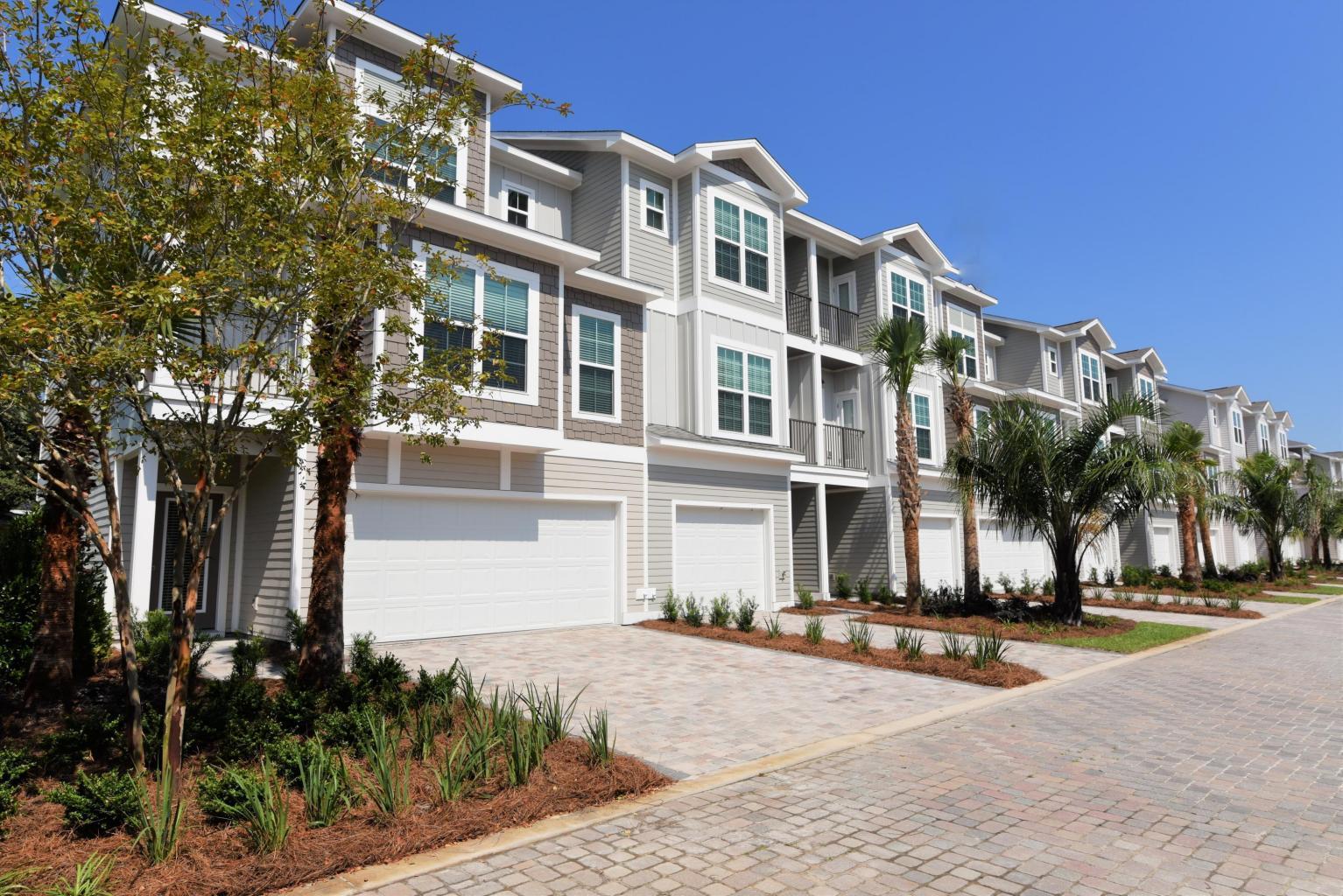 Fantastic opportunity for 1 of the BEST rental property investments in the area in one of the nicest, well constructed BRAND NEW townhomes just 700' to the beach! Great 3 story townhomes with a 1 car garage; fiber cement board siding/trim, tile ground floor, tiled insulated garage w/dehumidifier, bunk room, storage, oak flooring, crown molding, neutral color scheme, all Frigidaire appliances, 2 sets of w/dryers, 3 ac units, superb master bath with glass shower doors, separate steel soaking tub, walkin closet, huge butcher block style table and all beautifully landscaped. Heated pool with mens/ladies room and sundeck. 3 min. walk to the beach at Pompano Joes; Low monthly dues of $215. Est. rental projections $80K+ -best deal around for the price/style/location! Must see! Open 7 days/wk.