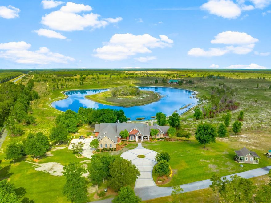 Rare Offering: 187-Acre Private Estate. Owner Financing Available. Welcome to 2601 Highway 20 E, a once-in-a-lifetime opportunity to own a breathtaking private estate in Panama City, Florida. Set behind a grand 14-foot private gate and surrounded by over 100 acres of rolling pasture, tall pines, and a fully stocked private lake, this custom-built home offers the perfect balance of luxury, functionality, and country living. Built in 2007 with quality and craftsmanship at its core, this expansive 6-bedroom, 6 full bath, 2 half bath estate boasts over 7,351 square feet of heated and cooled living space. From the moment you step inside, you are welcomed by soaring vaulted ceilings, large open spaces, and thoughtfully designed finishes. The first floor is constructed with solid concrete block for strength and longevity, while the second floor features durable 2x6 framing for added efficiency and durability. The spacious primary suite is a true retreat, featuring his and her closets, a spa-like bath with custom tile shower, and peaceful views of the surrounding property. Entertain with ease in the formal dining room or game room, host unforgettable gatherings around the outdoor kitchen, or retreat to the cozy study for a quiet evening. The gourmet kitchen and luxurious living areas flow seamlessly to the outdoors, where a zero-entry saltwater pool, lush landscaping, and breathtaking lake views await. Additional features include spray foam insulation in the walls and ceilings, Andersen storm doors and windows, and four HVAC units for maximum energy efficiency. For convenience and peace of mind, the property is equipped with two 200-amp electrical panels, a whole-house security system, two deep wells, two septic systems, and a 40KW whole-house generator powered by two 500-gallon propane tanks. The estate also includes a three-car garage with insulated 12' x 8' doors, offering plenty of space for vehicles, recreational toys, or additional storage. Beyond the main residence, a massive 60' x 100' enclosed workshop with four roll-up doors provides endless possibilities for equipment storage, RVs, or hobbies. The land is fenced on three sides and thoughtfully enhanced with pines planted in 2021 for future privacy. Equestrian enthusiasts will love the 60' x 60' Cypress horse barn, complete with seven stalls, each with individual water lines, ideal for horses, livestock, or an operational farm. 575 by 500 Fenced Area ideal for Livestock. At the heart of this estate lies a serene spring fed lake, with bass, bream, and catfish, offering the perfect backdrop for fishing, paddling, or simply relaxing in the beauty of nature. This is more than a home  it's a lifestyle. A place where wide-open spaces meet modern comforts. Where you can enjoy quiet mornings by the lake, sun-drenched afternoons by the pool, and peaceful evenings under the stars. Whether you dream of creating a family compound, running an equestrian retreat, or simply escaping to your own private paradise, 2601 Highway 20 E offers a rare and exceptional opportunity. All of this  located just minutes from Panama City, Lynn Haven, and 17 Miles from the world's most beautiful beaches. Opportunities like this are rare. Come experience it for yourself.
 