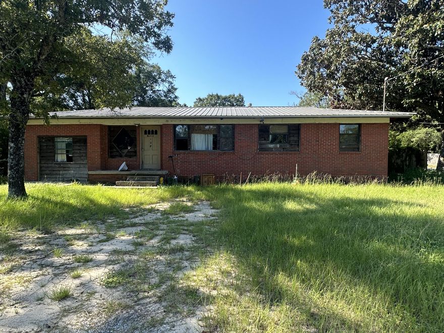 Fixer Upper ! Brick, Metal Roof, Hardwood Floors, Large Corner lot!