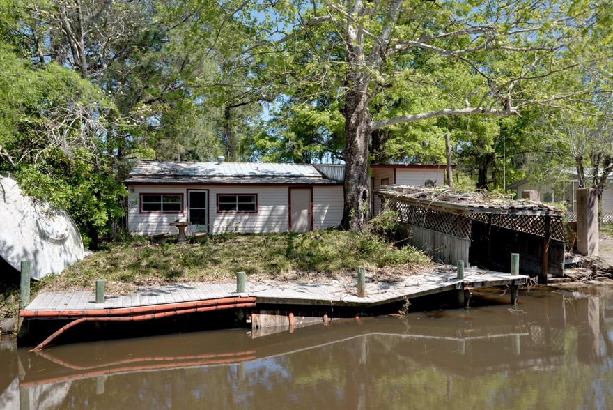 Waterfront older home off Mack Bayou on the canal. Offers large sun room/porch, living room with fireplace that's been partially remodeled, family room/dining room and two-three bedrooms. Needs work! Imagine having a waterfront bungalow in this popular area, or fixing it up to re-sell. The canal front setting, affordable price, opportunity and location close to Sacred Heart Hospital, myriad shopping and dining venues, beach or boating out to Choctawhatchee Bay from your own property make this home ideal for an investor or ambitious homeowner. Seller open to offers. Sold as is. Buyer to verify all data.