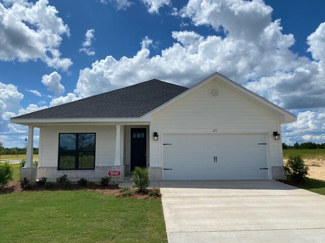 Located just 20 minutes from South Walton beaches!  Conveniently located within a mile of Freeport High School.  This Craftsman style home has 3 bedrooms & 2 baths.  Full Brick exterior  with stylish, black window frames. Open concept plan with a cathedral ceiling in the main living area, 9' ceilings in bedrooms 2 & 3 + a 10' trey ceiling in the Master Bedroom.   8' entry doors, quartz countertops and durable CoreTec Pro Plus luxury vinyl plank flooring throughout; no carpet.   Fully sodded yard, sprinkler system with well and pump, garage door opener and pull-down attic stairs are all included!  Seller pays most closing costs with an approved lender.