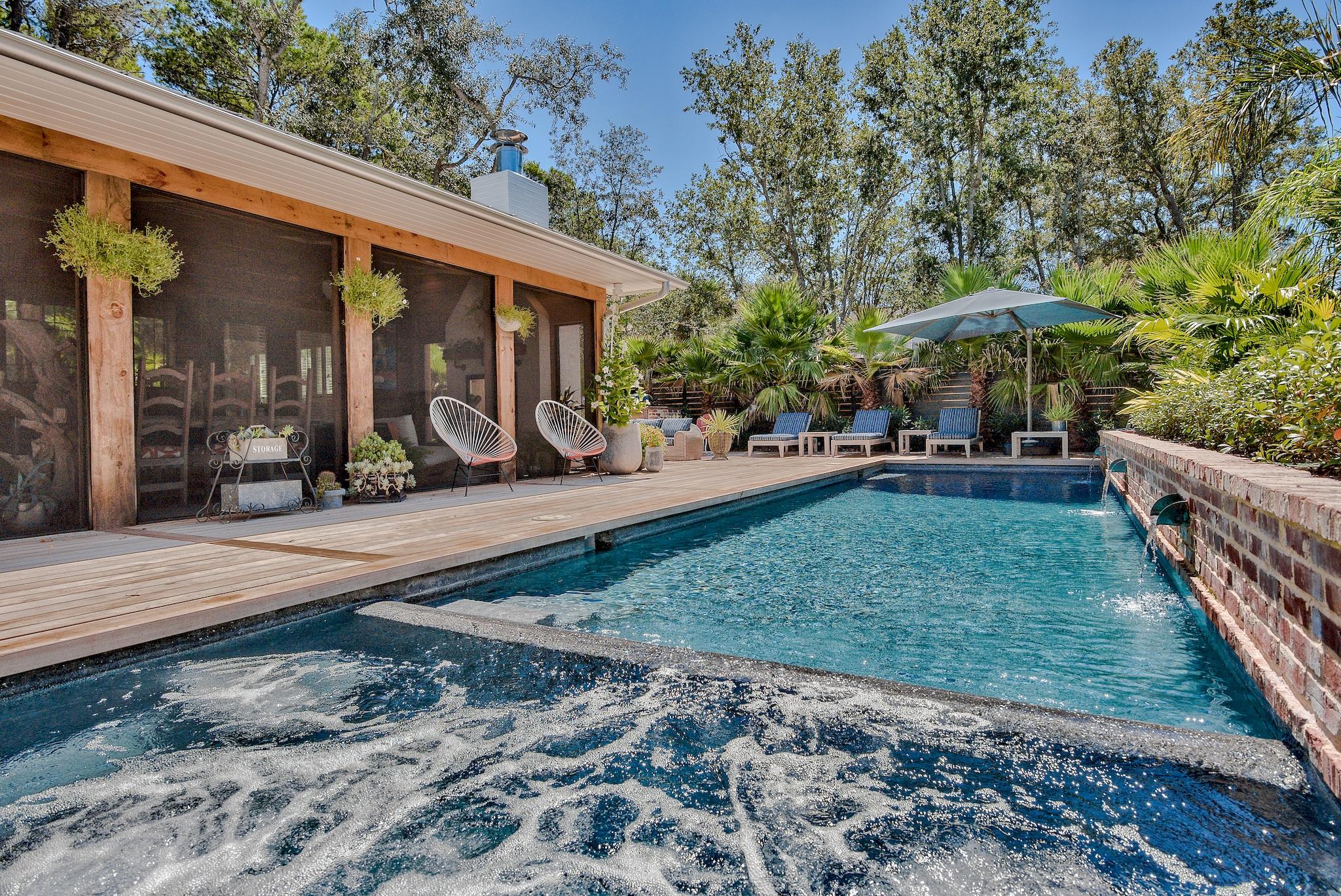 This completely 2019 remodeled home is the perfect beach oasis, nestled on arguably the quietest street off 30A with close proximity to all of the eastern end's amenities. Once you arrive, you're immediately brought back to the Old Florida of years gone by. As you enter this single level home, you're greeted by an expansive living area with 13' vaulted ceilings in the living room complemented with a gorgeous brick fireplace. Adjacent is a large kitchen that calls out for entertaining and is designed for the true chef with an abundance of custom cabinetry, a huge walk-in pantry, a professional size range, two dishwashers, and two refrigerators.120 year old reclaimed oak flooring is prevalent throughout, reclaimed heart pine highlights the wine bar and cozy study nook.The master bedroom