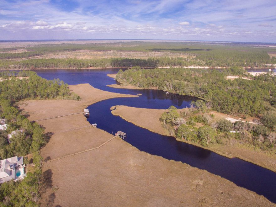 With 166 feet of water frontage, this tree thick waterfront lot on Peach Creek is your opportunity to build a dream home with access to the bay. Rich in wildlife and fish, Peach Creek is the destination for anyone that loves being on the water, fishing and enjoying nature. With Peach Creek leading out to the bay, you enjoy the peaceful tranquility of the creek with the option of the open water just a short boat ride away.