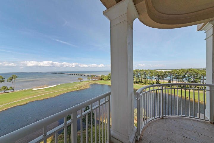 The residences of One Water Place at Kelly Plantation simply redefines condominium living. Enjoy beautiful views from this luxury condo overlooking the bay, lake and Kelly Plantation golf course. Freshly painted with new lighting, this beautiful unit presents like new! Located on the 7th floor, with the largest floor plan available in One Water Place (The Darlington) featuring 3 bedrooms plus an office/ media room.The spacious living area with double sided gas fireplace accesses two balconies, one complete with an outdoor kitchen & built in gas grill. The chef quality kitchen has stainless steel Viking appliances with solid wood cabinets, granite counter tops, and travertine floors. The formal dining room offers a pass through from the kitchen as well as a private pantry or can be conver