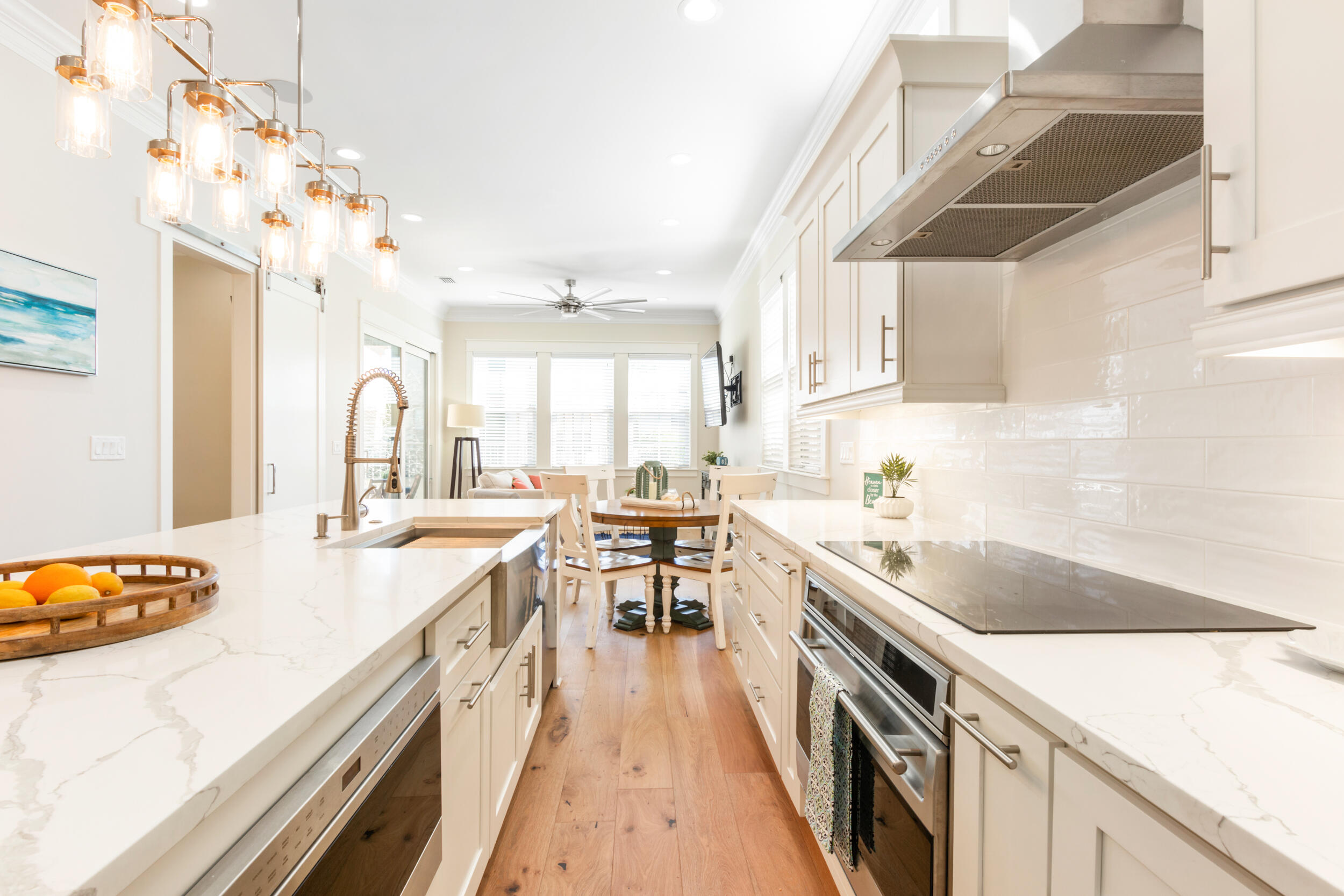 This fully furnished, custom home with four bedrooms and FOUR full bathrooms is one of the most luxurious in Villa Lago.  The upscale kitchen is equipped with WOLF and SUBZERO appliances, white quartz counters, and bar seating at the nearly 10 ft island. The home features the only full summer kitchen in Villa Lago, which overlooks the water and features a Memphis pellet grill. The home includes one master suite downstairs and one upstairs. Upstairs you'll find a  bunk room, bedroom with queen bed, and second master suite.  The master bath features a large jacuzzi tub, stone walk-in shower, and walk in closet. Each bedroom has private bathroom attached. Bonus sitting area with tv on the upstairs landing. Parking includes garage with fully epoxy coated floor and three parking spaces.